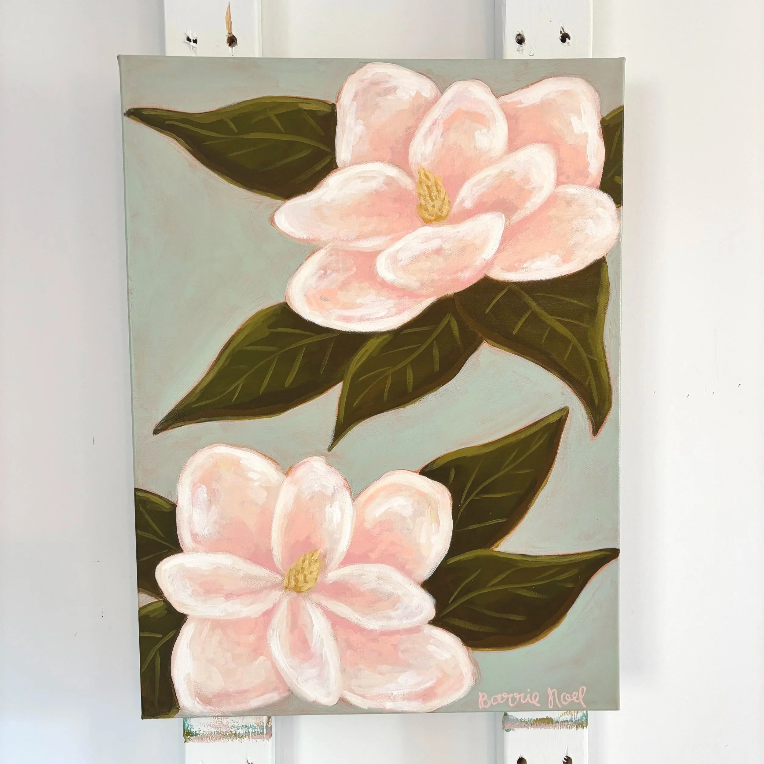 Original acrylic magnolia painting with pale pink blooms and soft green leaves on a light blue background.