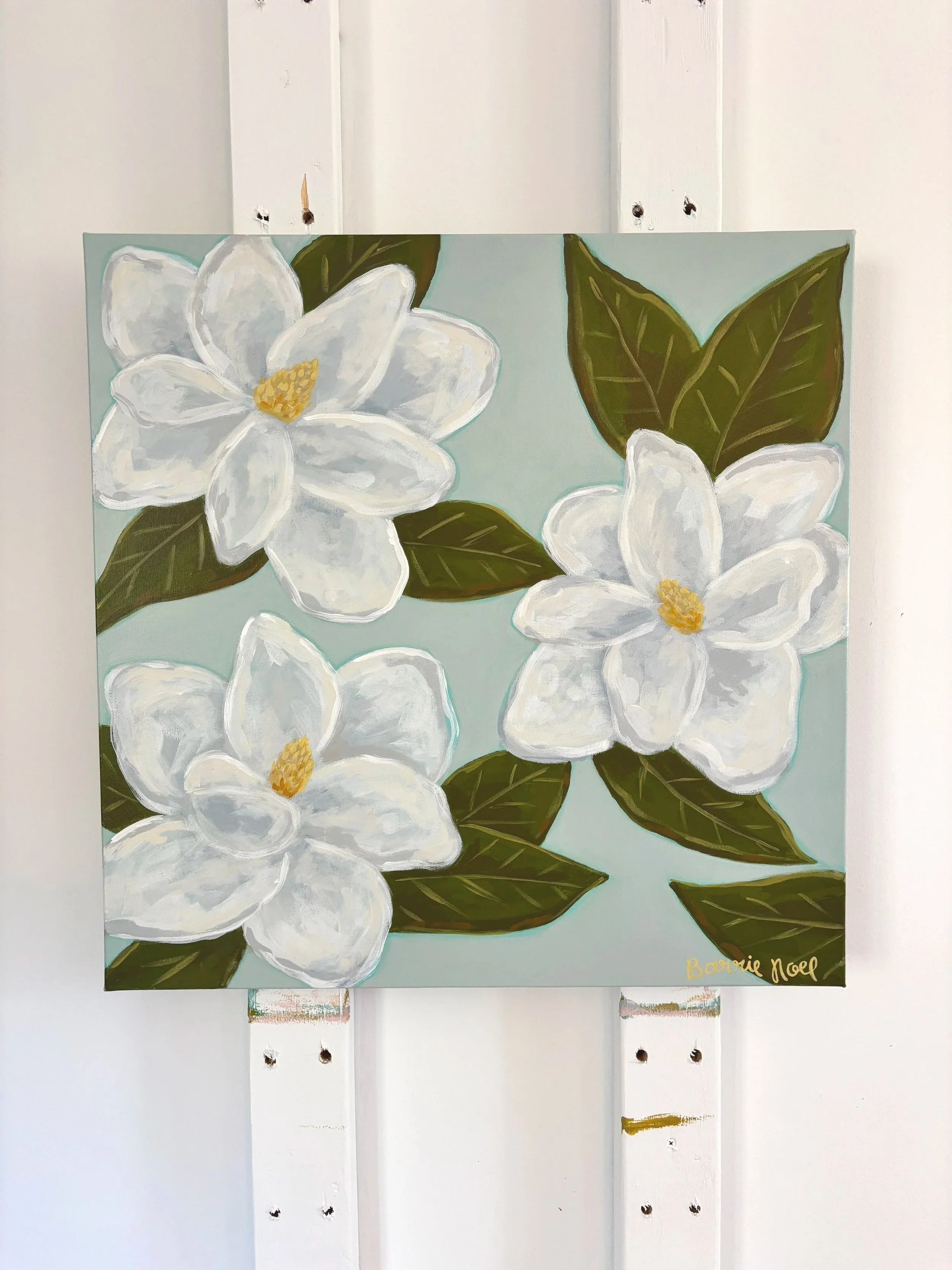 Original acrylic magnolia painting with creamy white blooms and soft green leaves on a light blue background.