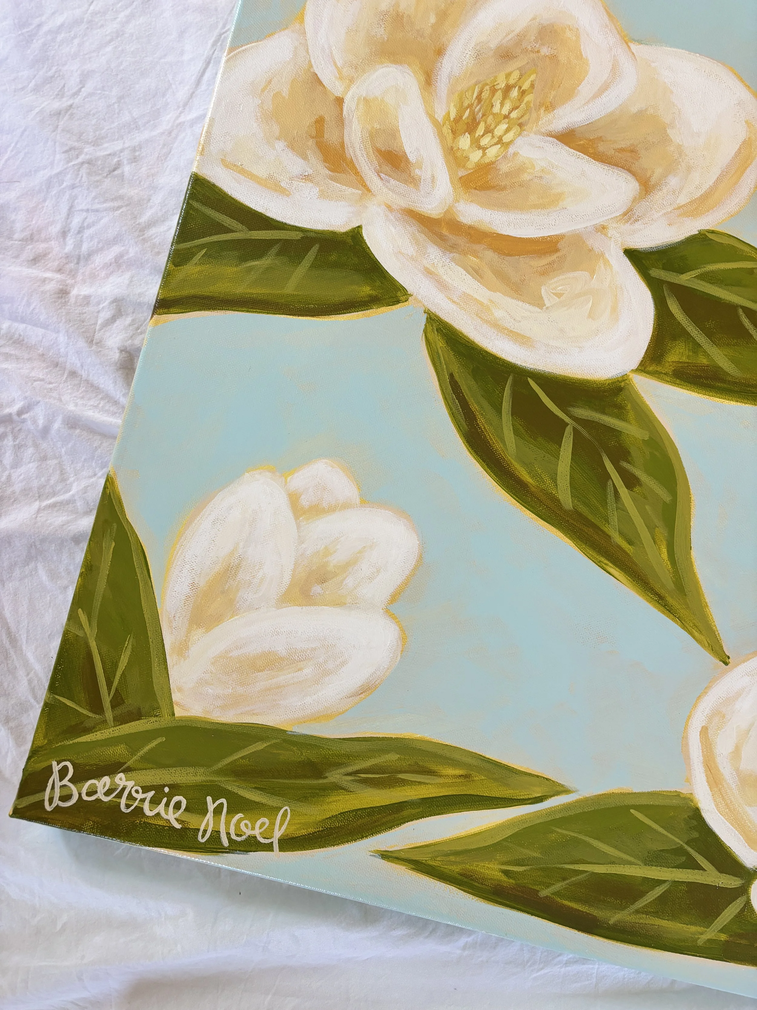 Original acrylic magnolia painting with cream blooms and soft green leaves on a light blue background.