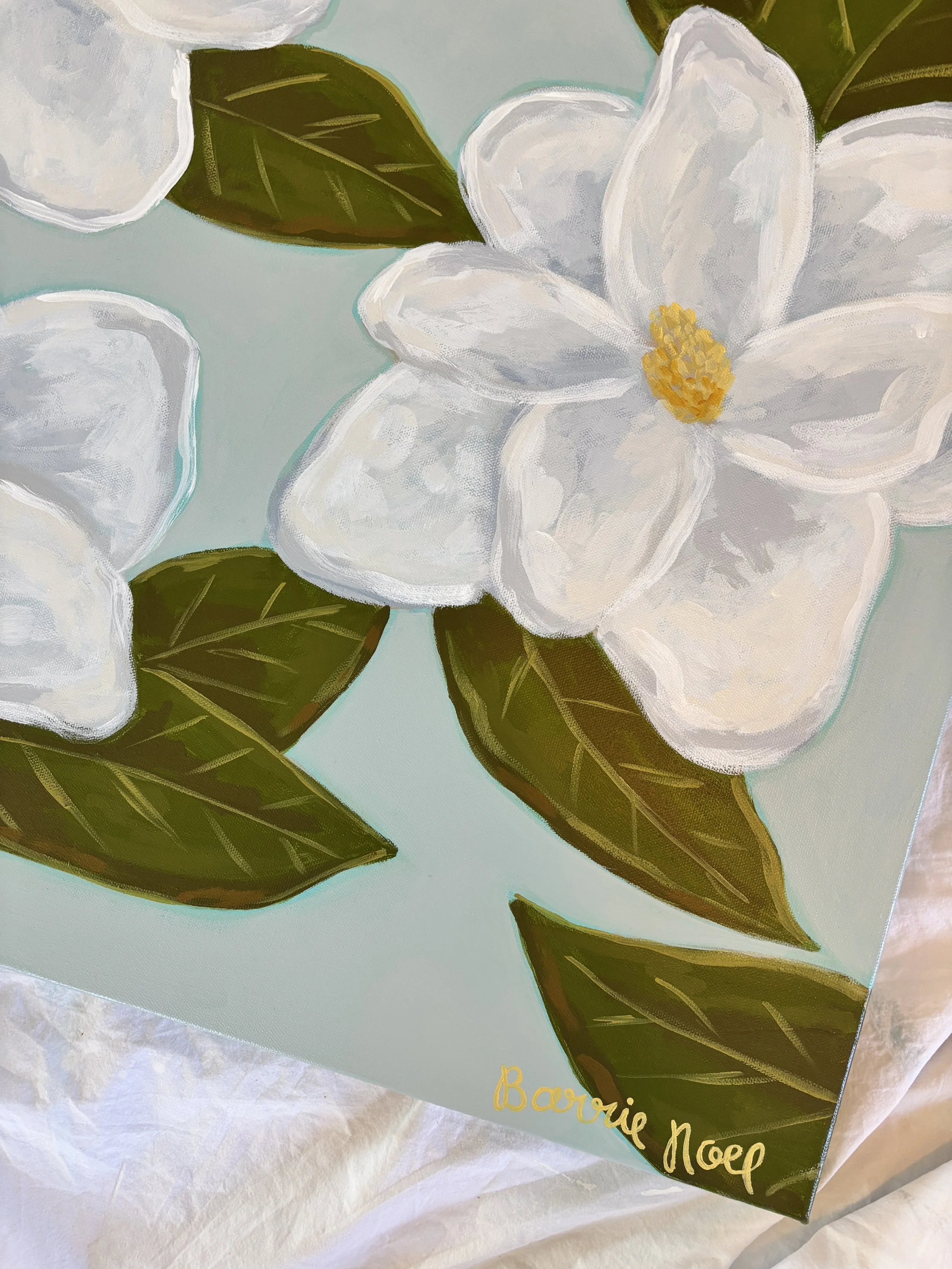 Original acrylic magnolia painting with creamy white blooms and soft green leaves on a light blue background.
