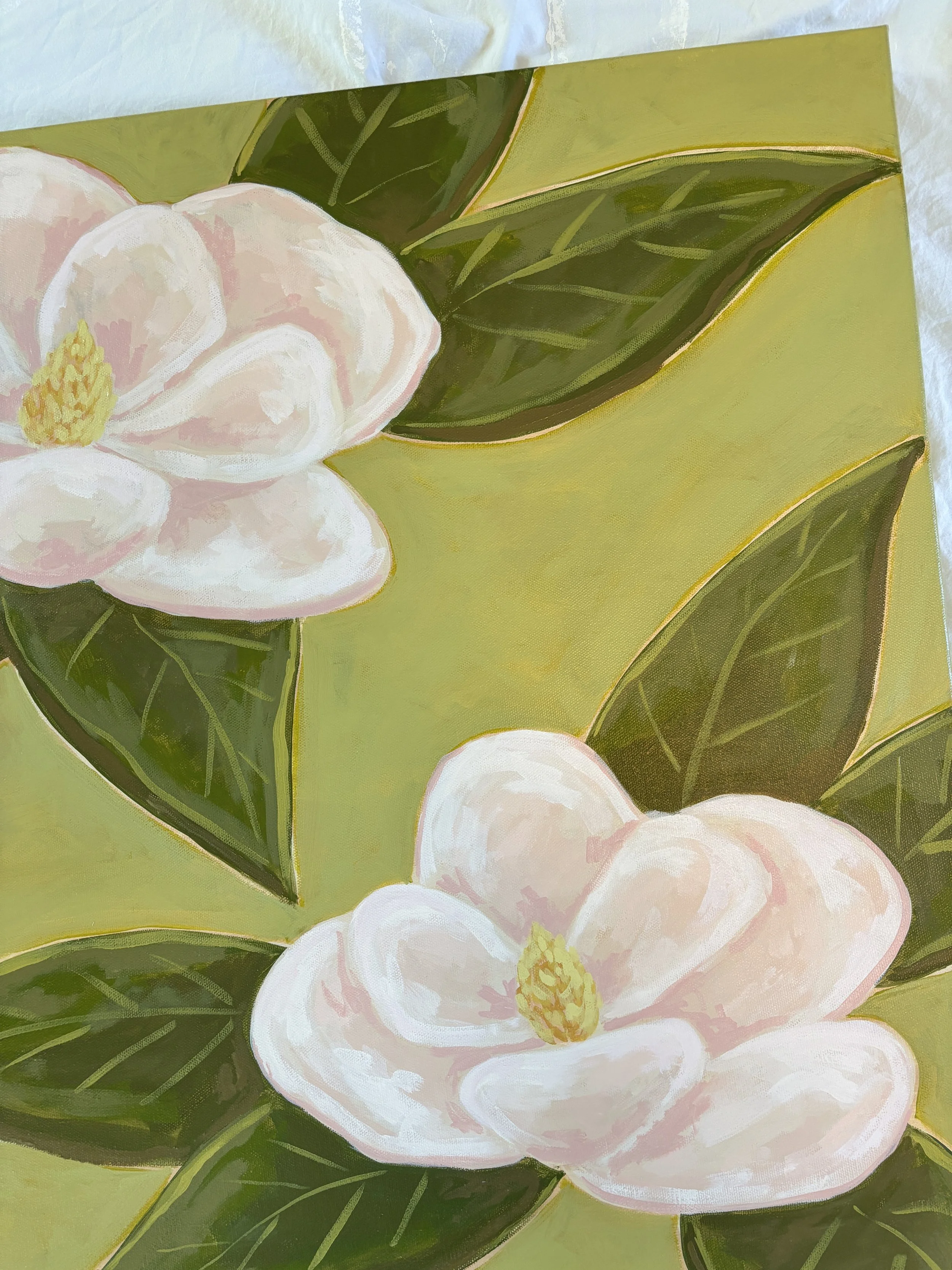 Original acrylic magnolia painting with pale pink blooms and soft green leaves on a fresh lime green background.