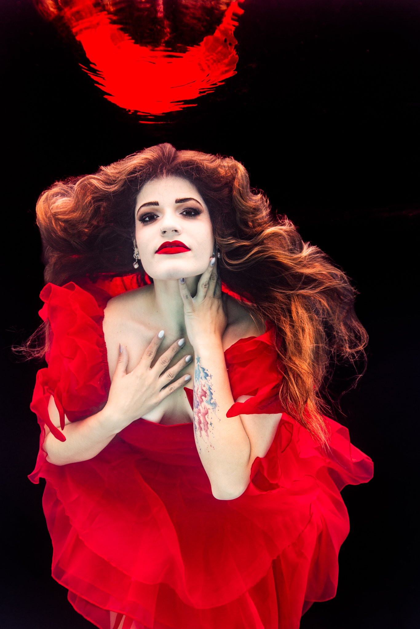 underwater red dress and lipstick model