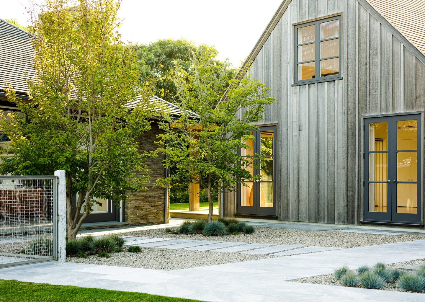 On Martha&rsquo;s Vineyard, @jamesdoyledesignassociates reimagined this vacation home with a naturalistic plan, embracing the beautiful coastal views of the property. A collection of salt tolerant ornamental grasses were included, and a seafront mead