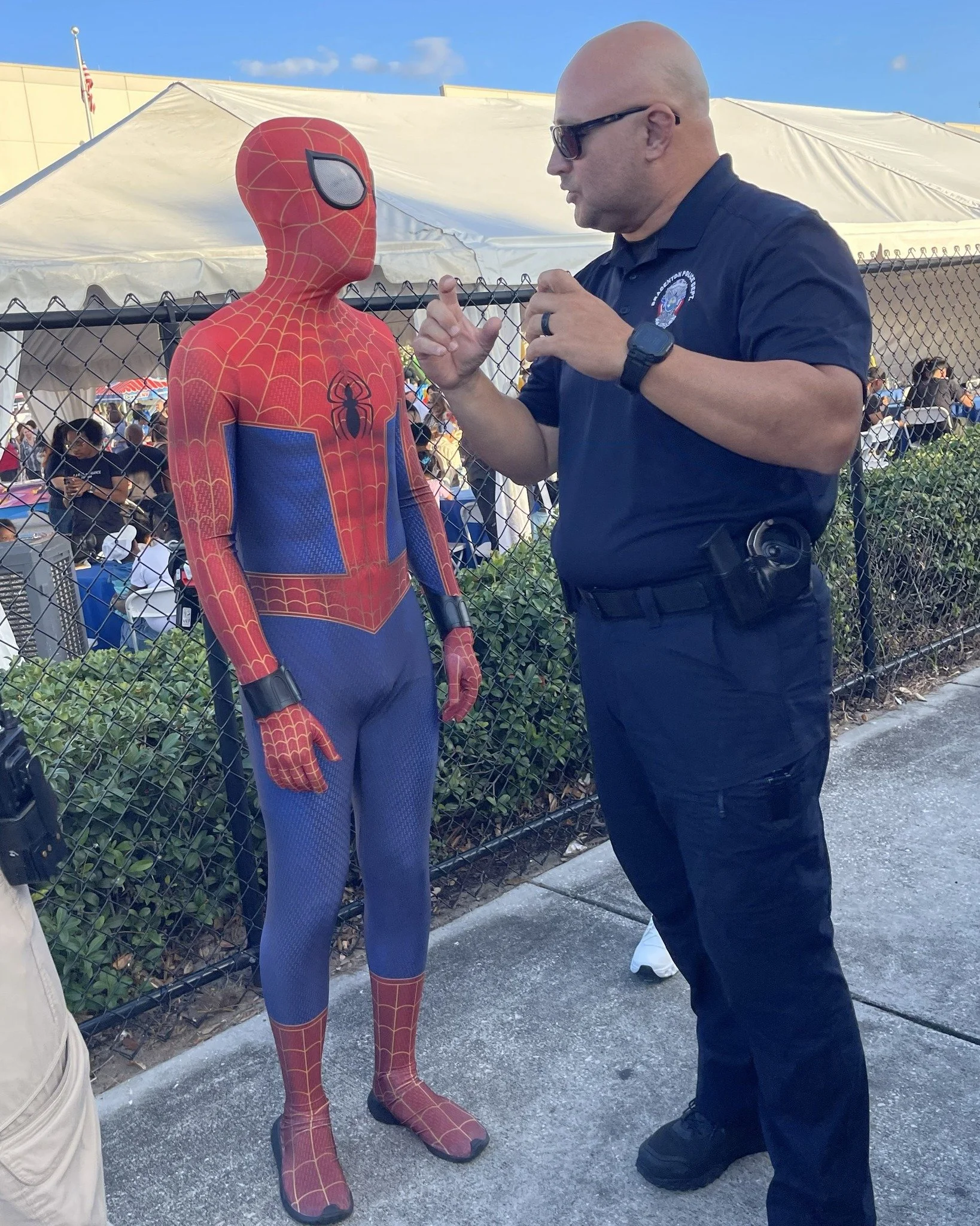We're not sure what this discussion is about, but we would like to think Officer Castro was explaining the concept of &quot;don't block the box&quot; to Spiderman.