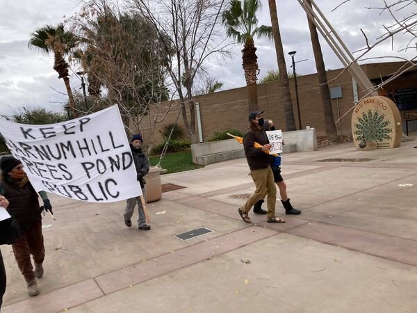 Walking with huge sign.jpg