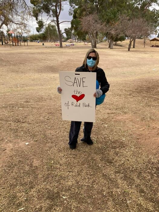 Save the Heart woman holding sign.jpg