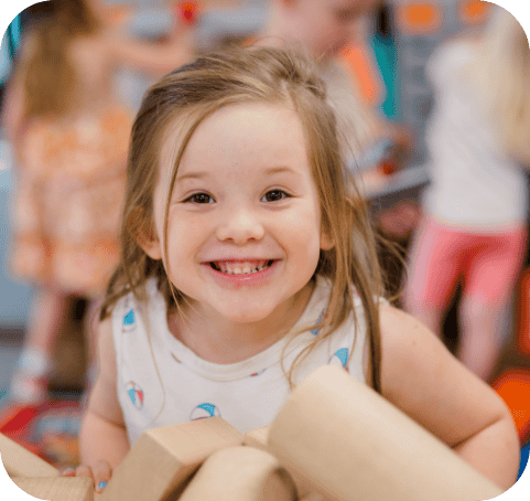Elephant room kid smiling playing with building blocks