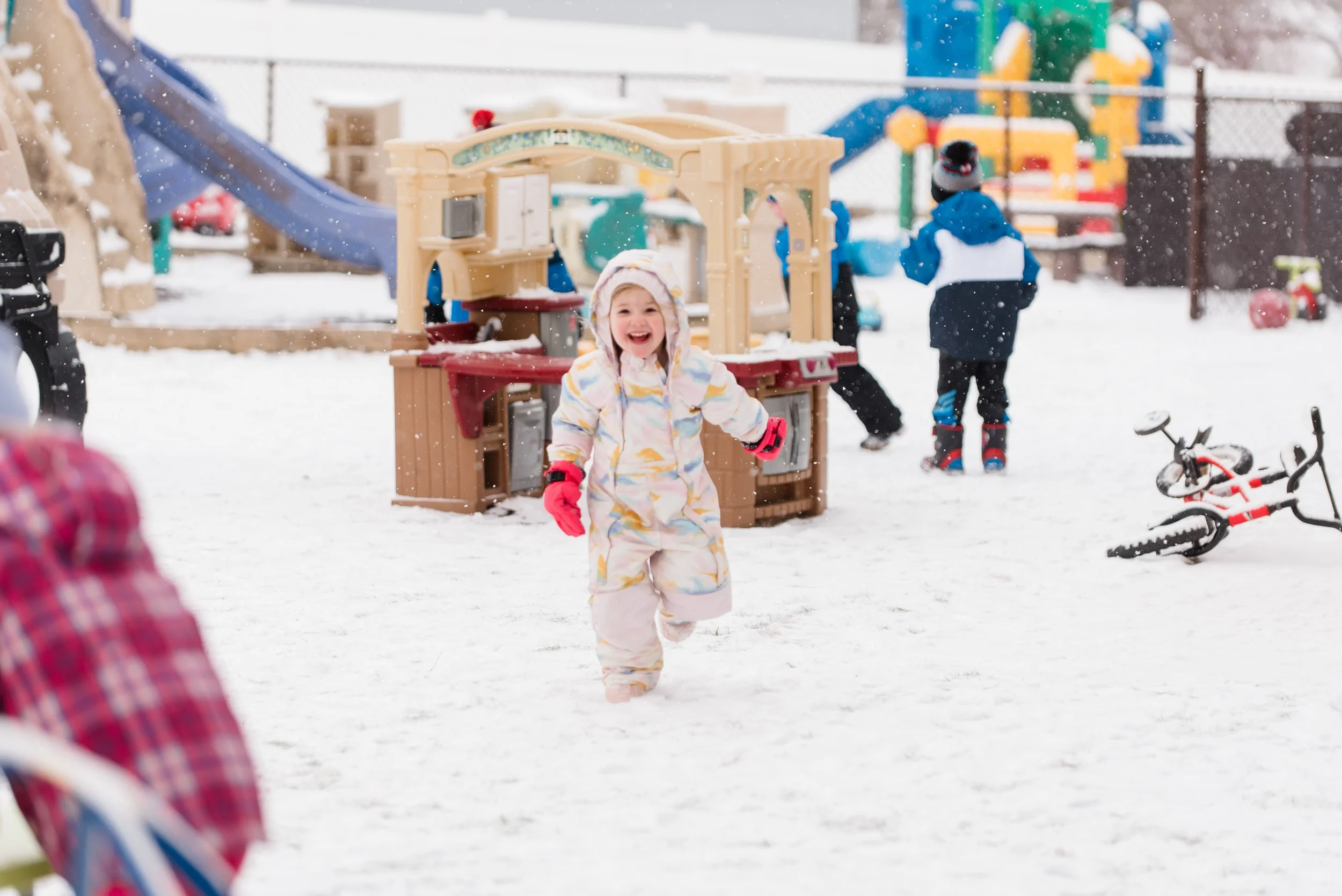 Young girl running in the snow