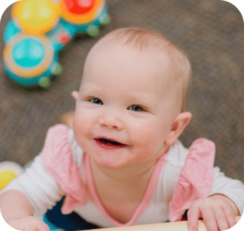 Caterpillar room baby smiling