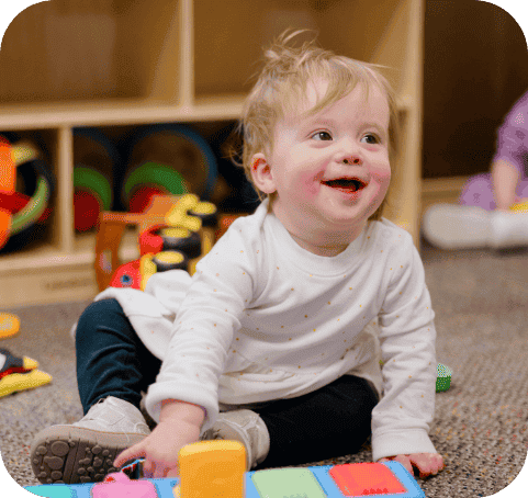 Butterfly room baby smiling playing with toys