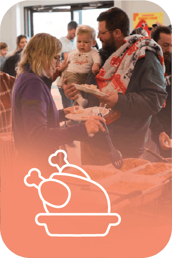 Families enjoying a thanksgiving dinner sponsored by Precious Angels