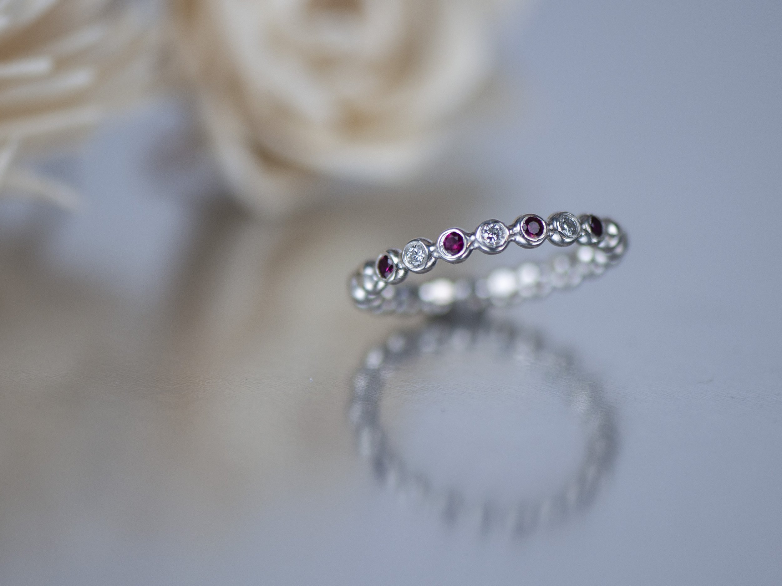 ruby and dia bubble ring floral background.jpg