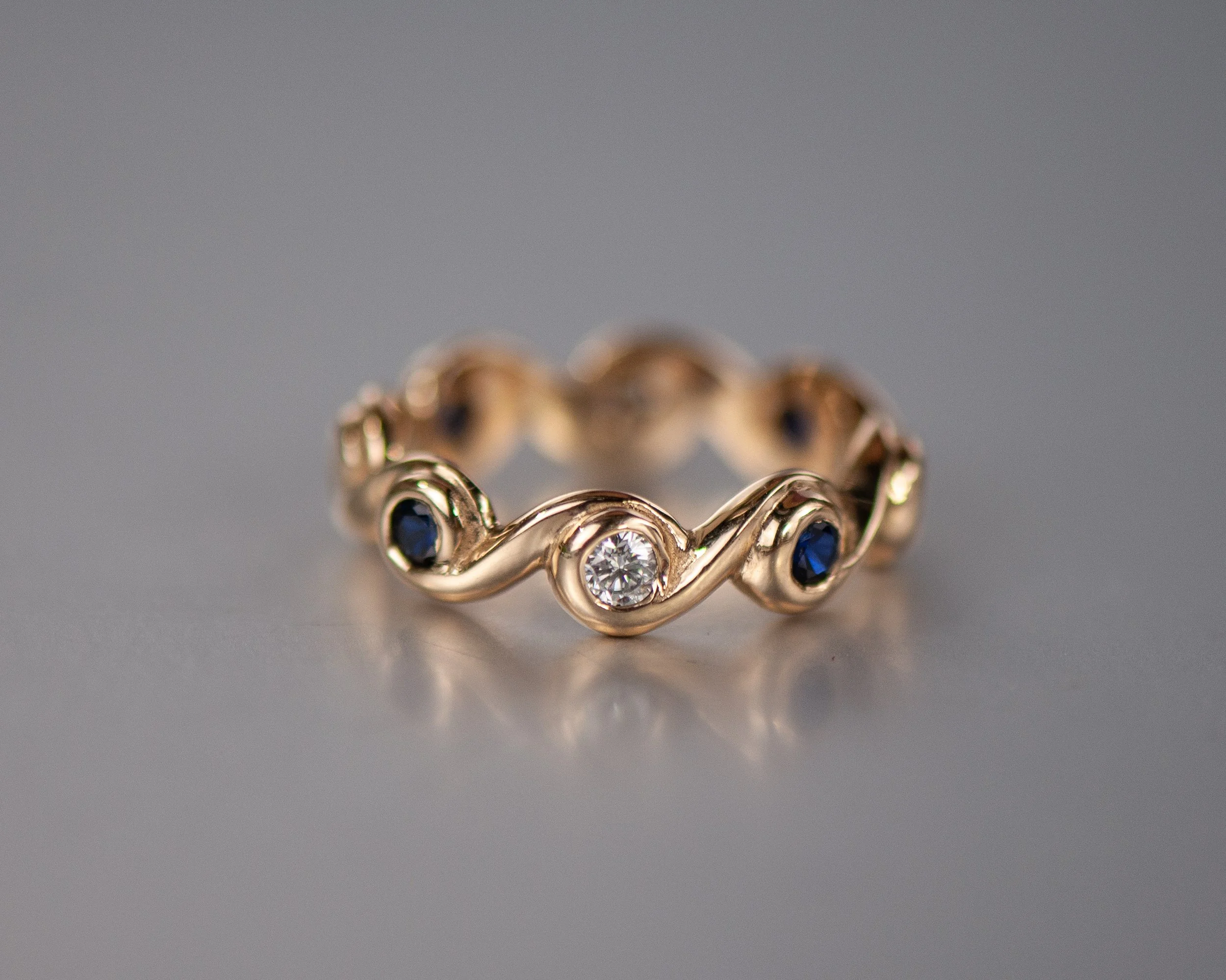 Custom wave design, hand carved carved, lab diamonds and lab blue sapphires