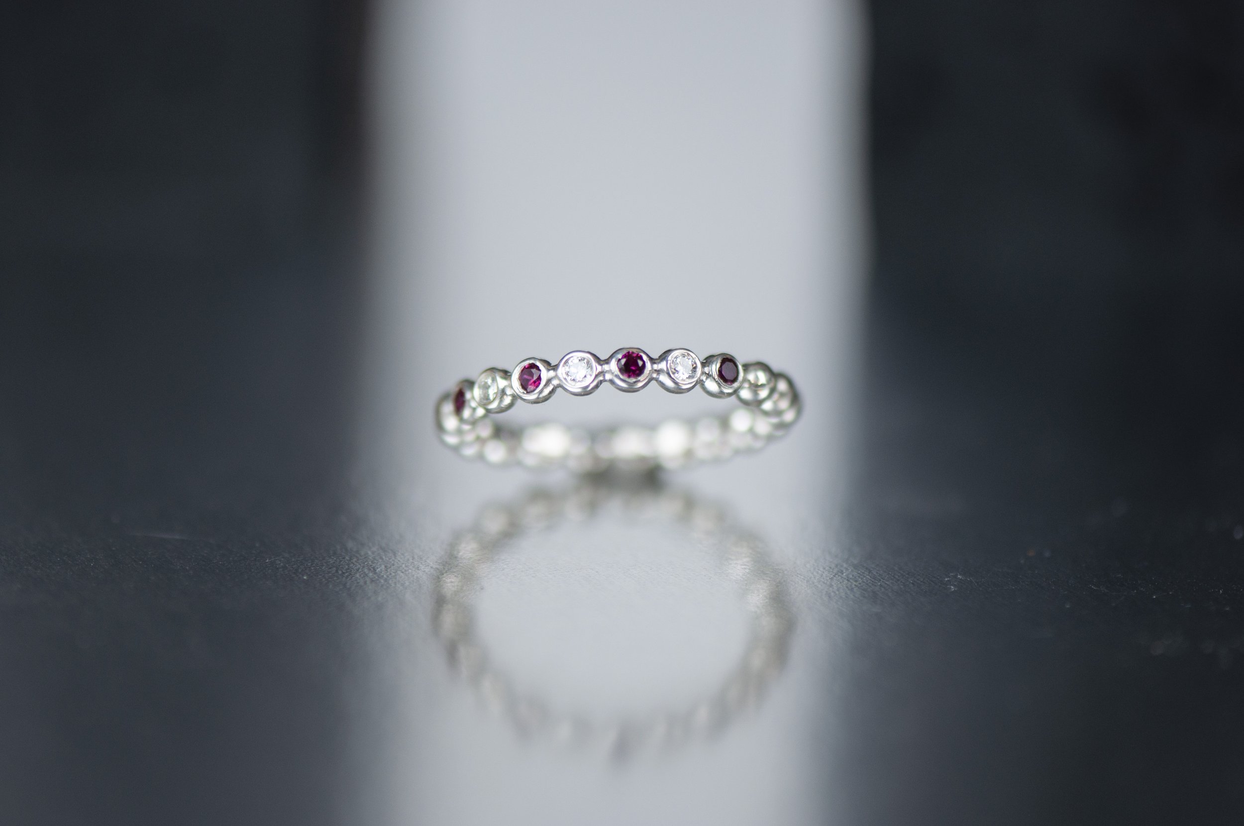 ruby and dia bubble ring with bold background.jpg