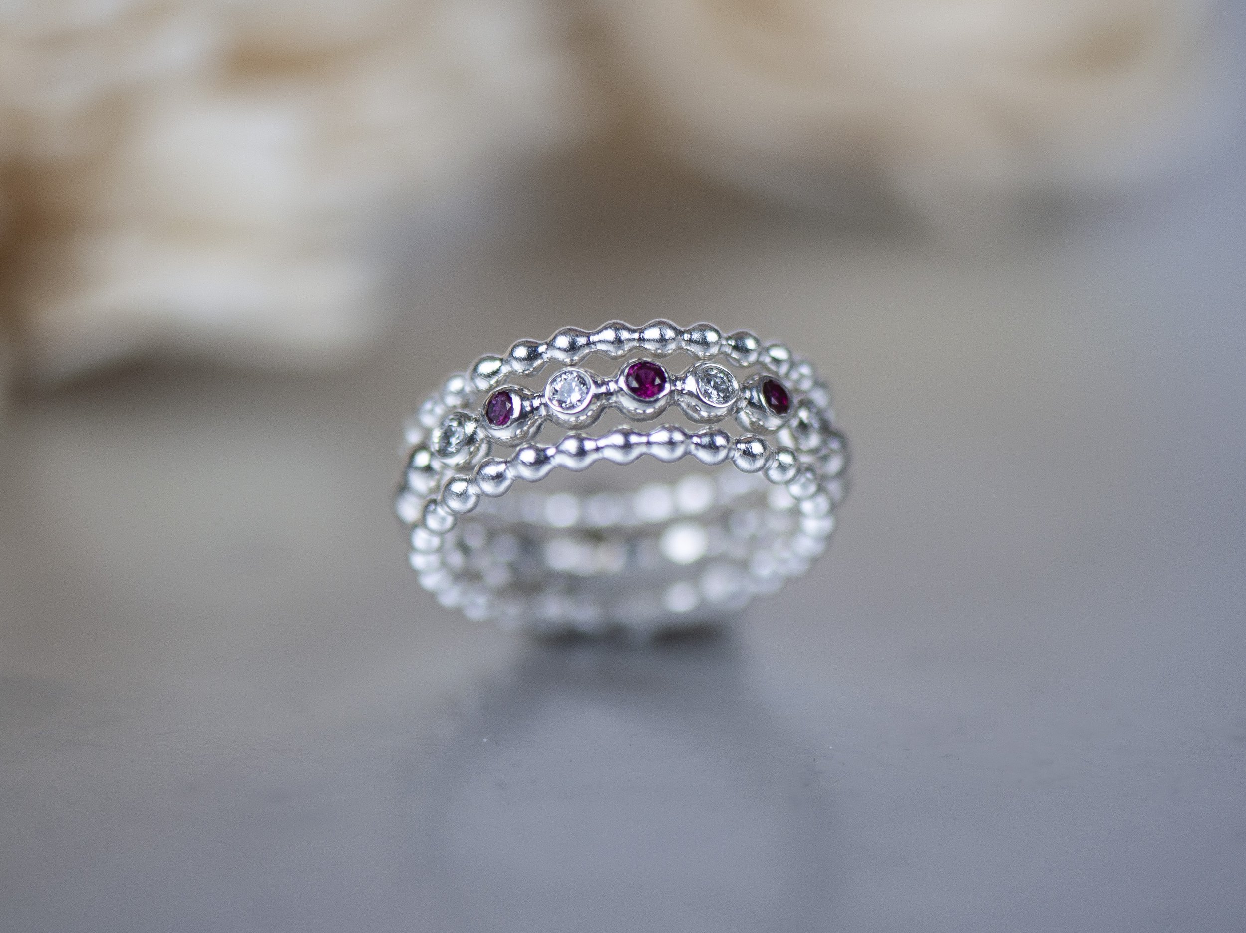 ruby and diamond bubble ring stack closer up.jpg