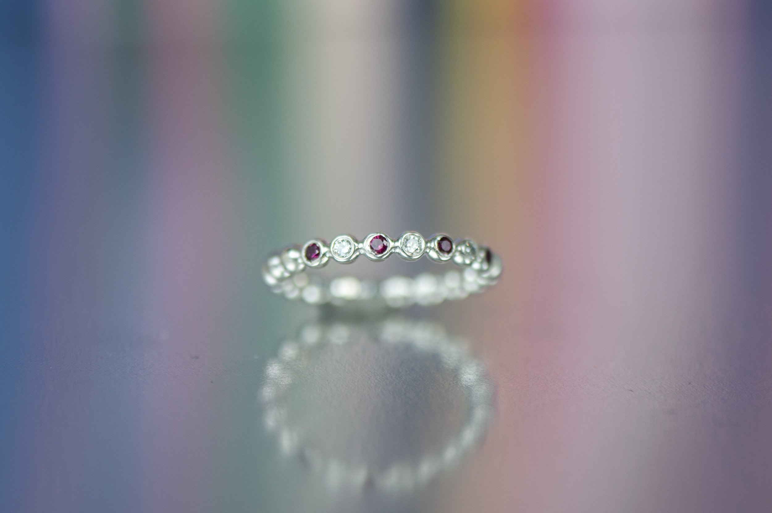 ruby and dia bubble ring rainbow background.jpg