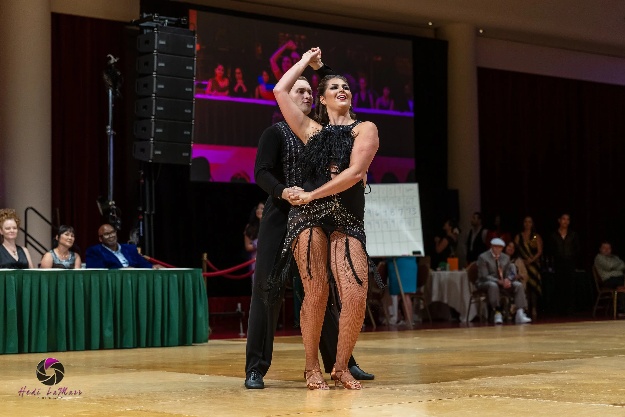 Alaina Tomesh, 2026 celebrity dance contestant at the 22nd annual Rhumba 4 Rainbow Gala, and dance partner Nikita Grygorchuk from Fred Astaire Dance Studio, take to the dance floor