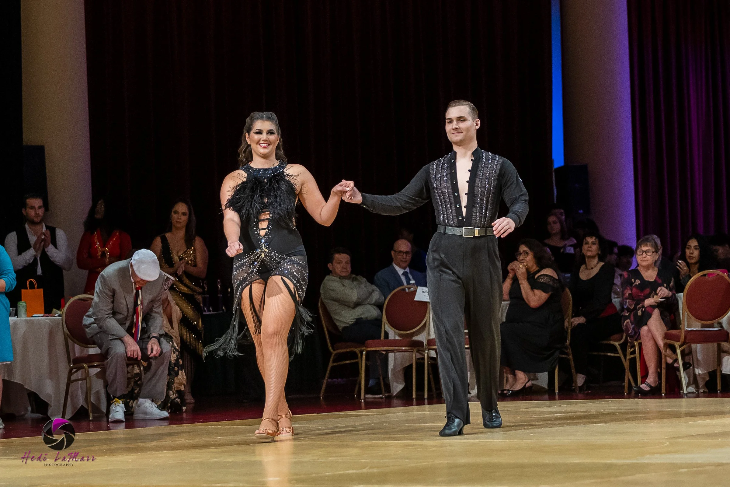 Alaina Tomesh, 2026 celebrity dance contestant at the 22nd annual Rhumba 4 Rainbow Gala, and dance partner Nikita Grygorchuk from Fred Astaire Dance Studio, take to the dance floor