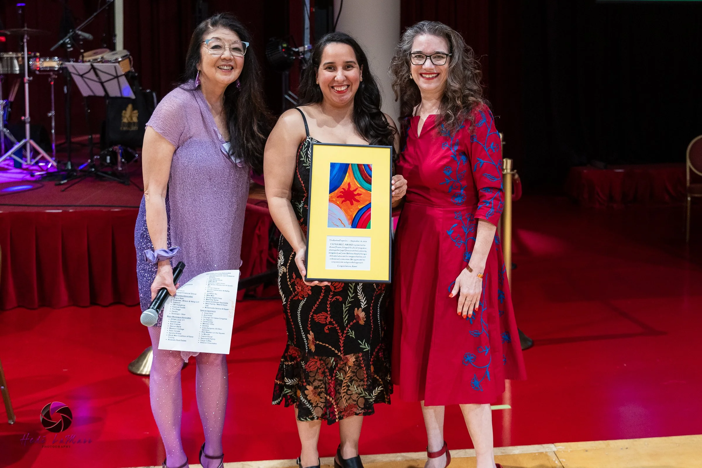 Aissa Olivarez, 2026 Extra Mile Award Winner photographed with Sharyl Kato (left), Rainbow Project Founder and Executive Director and presenter Melisa Agard (right), Dane County Executive