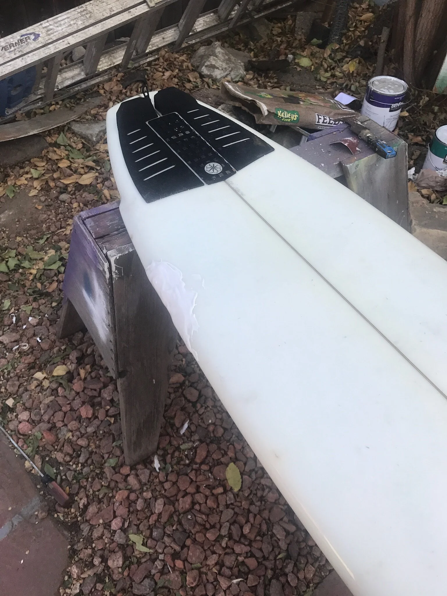 Epoxy is laid down in layers to avoid heat cracks and to help return the proper board shape. 