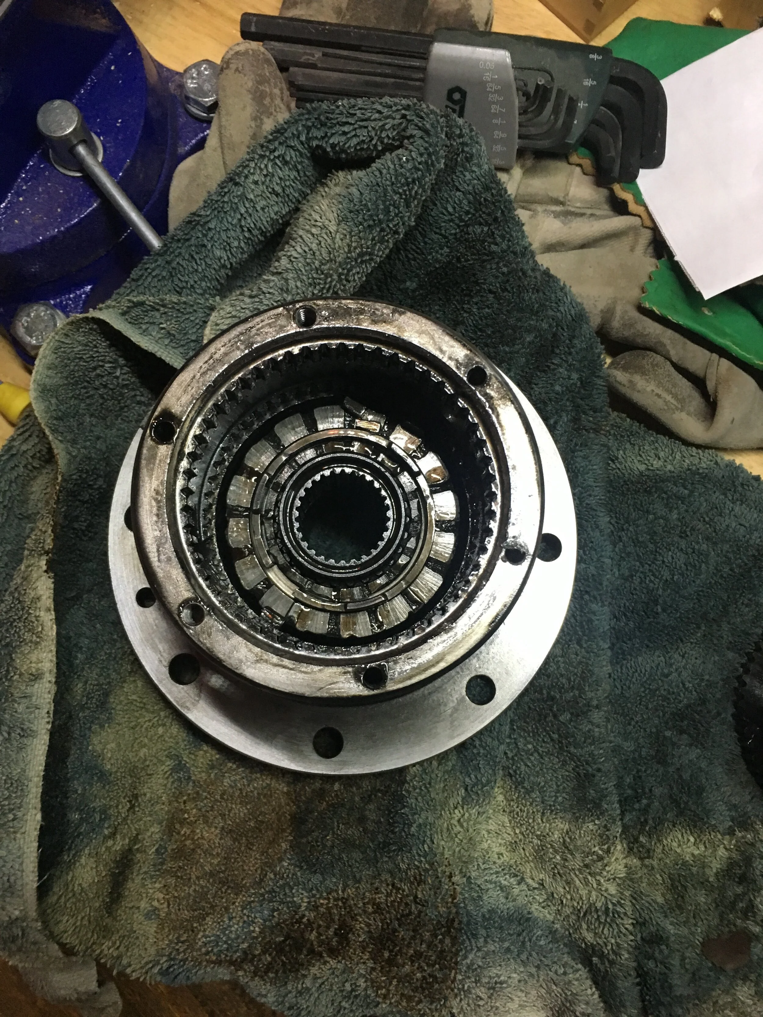 Broken Clutch Pack and Retainer meant the Rear Right Wheel was the only drive wheel with power and Rear Left Wheel became a free Wheel, rendering 2WD useless. Replaced Detroit Locker With Stock Open Differential. 