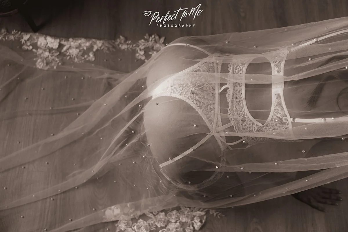bridal boudoir with white lingerie and long cathedral veil 