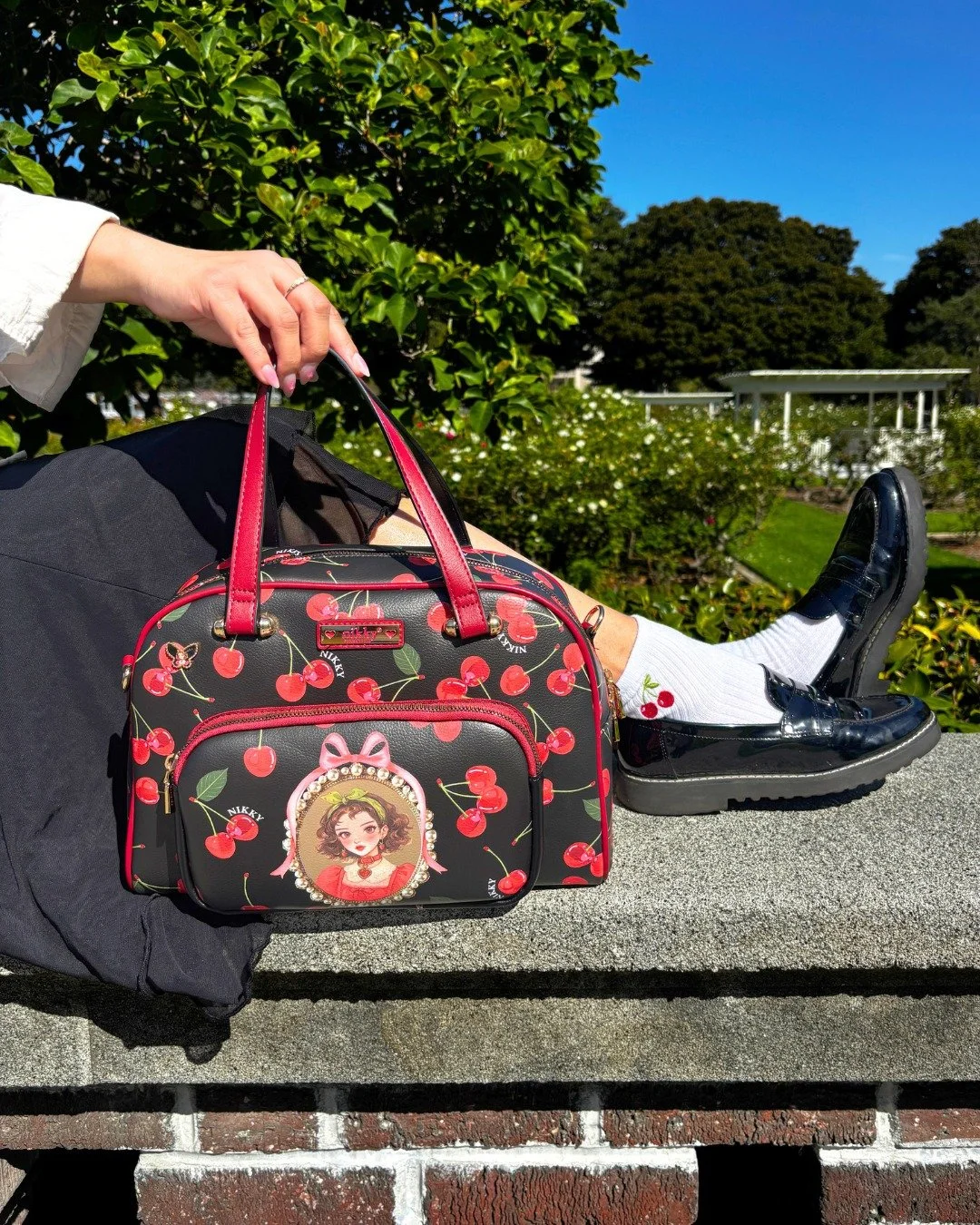 Cherry-coded details in the sunshine 🍒☀️

Our Cherry Lips collection is available via the link in bio!

#nikkybag #nicoleleeusa #SuzyHanDesigns #handbags #cherry