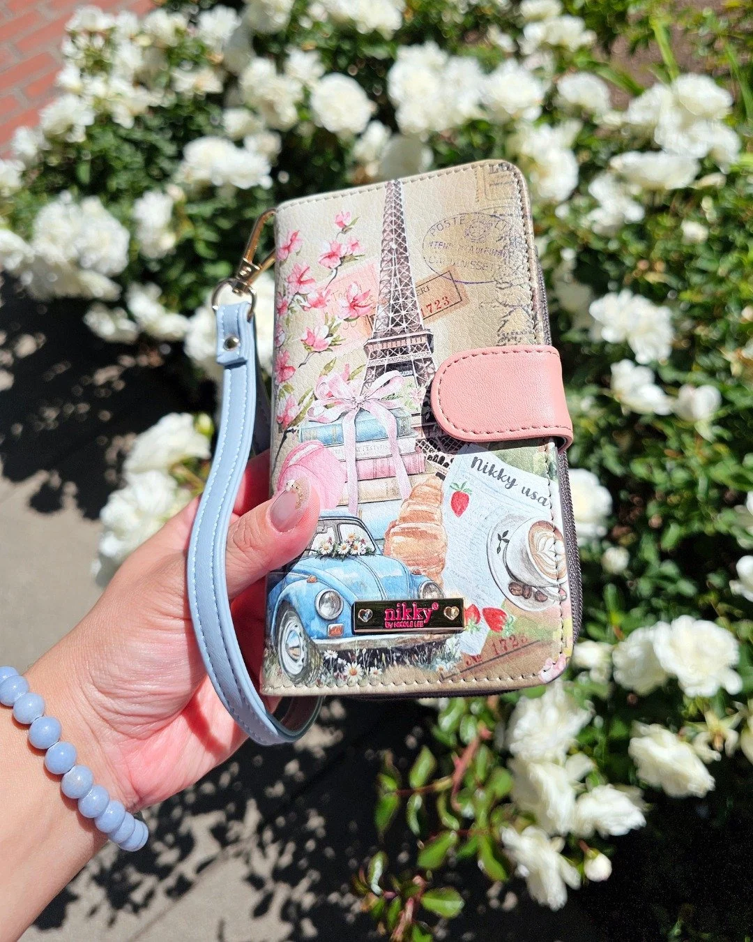The Nikky Phone Case Wallet keeps your essentials all in one place with space for your phone, cash, and credit cards, plus an attached back pouch and built-in mirror for easy touch-ups on the go. 🪞✨

View the available prints for the phone case wall