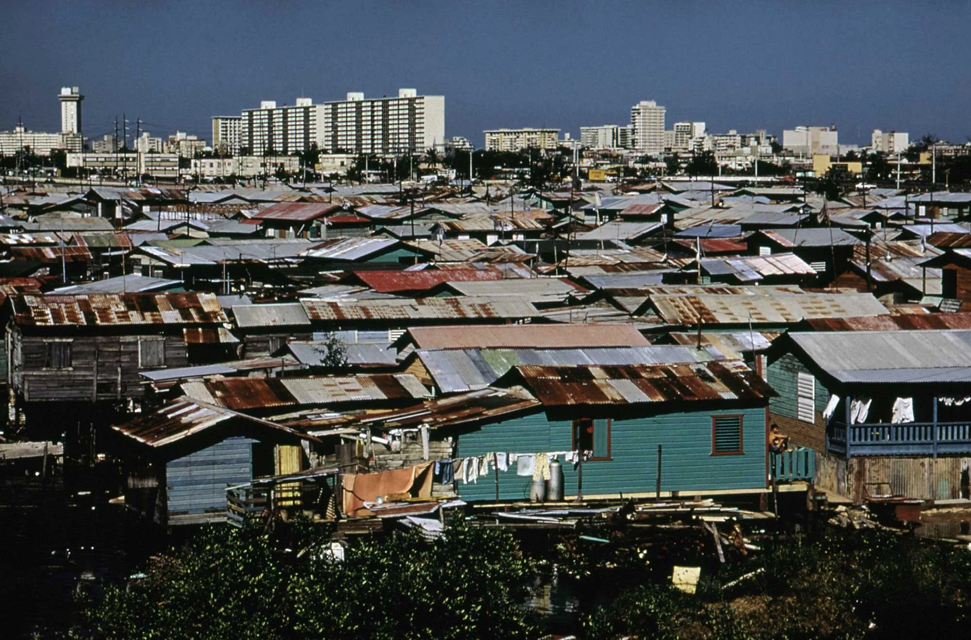 February 1973: Modern buildings over shanties, Martin-Pena Canal