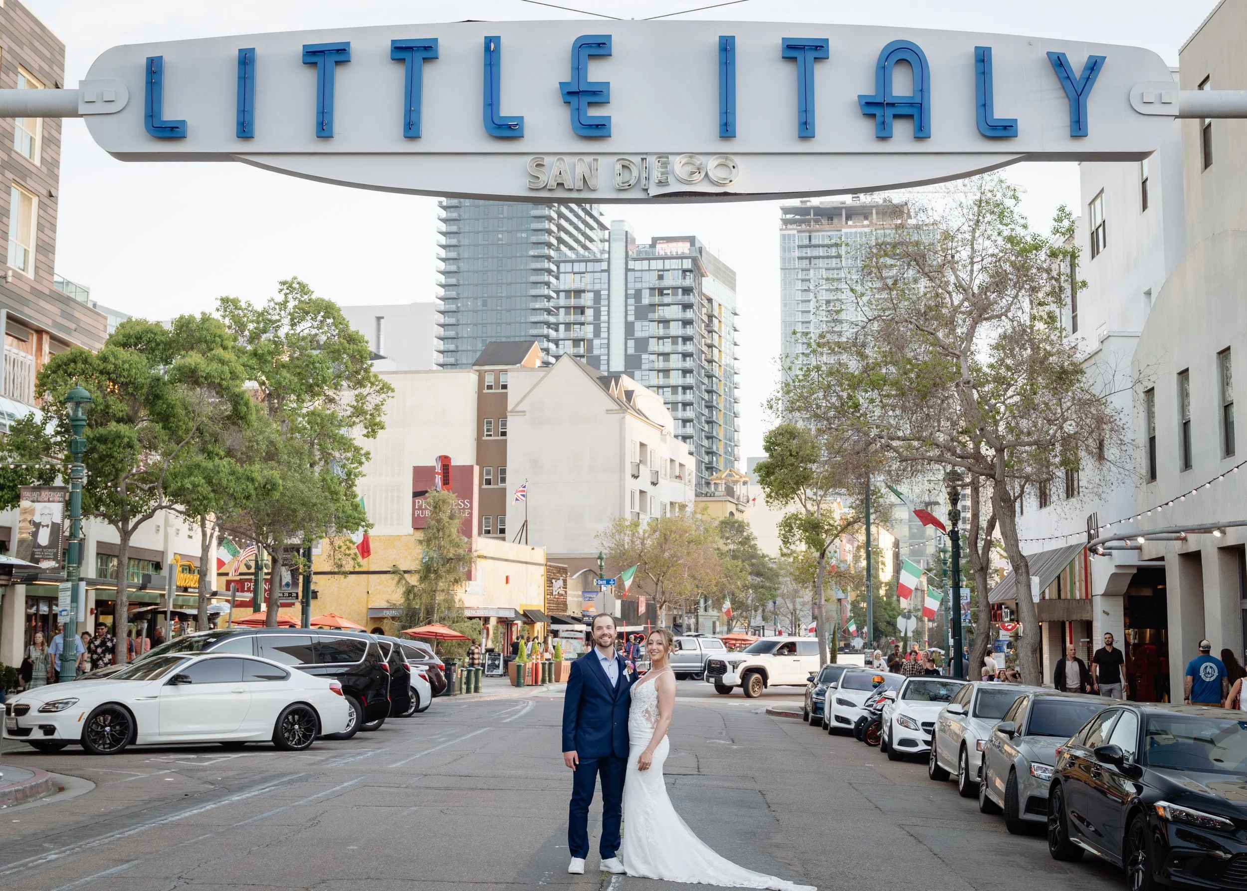 Elopement couple under the Little Italy sign, San Diego — destination wedding photography