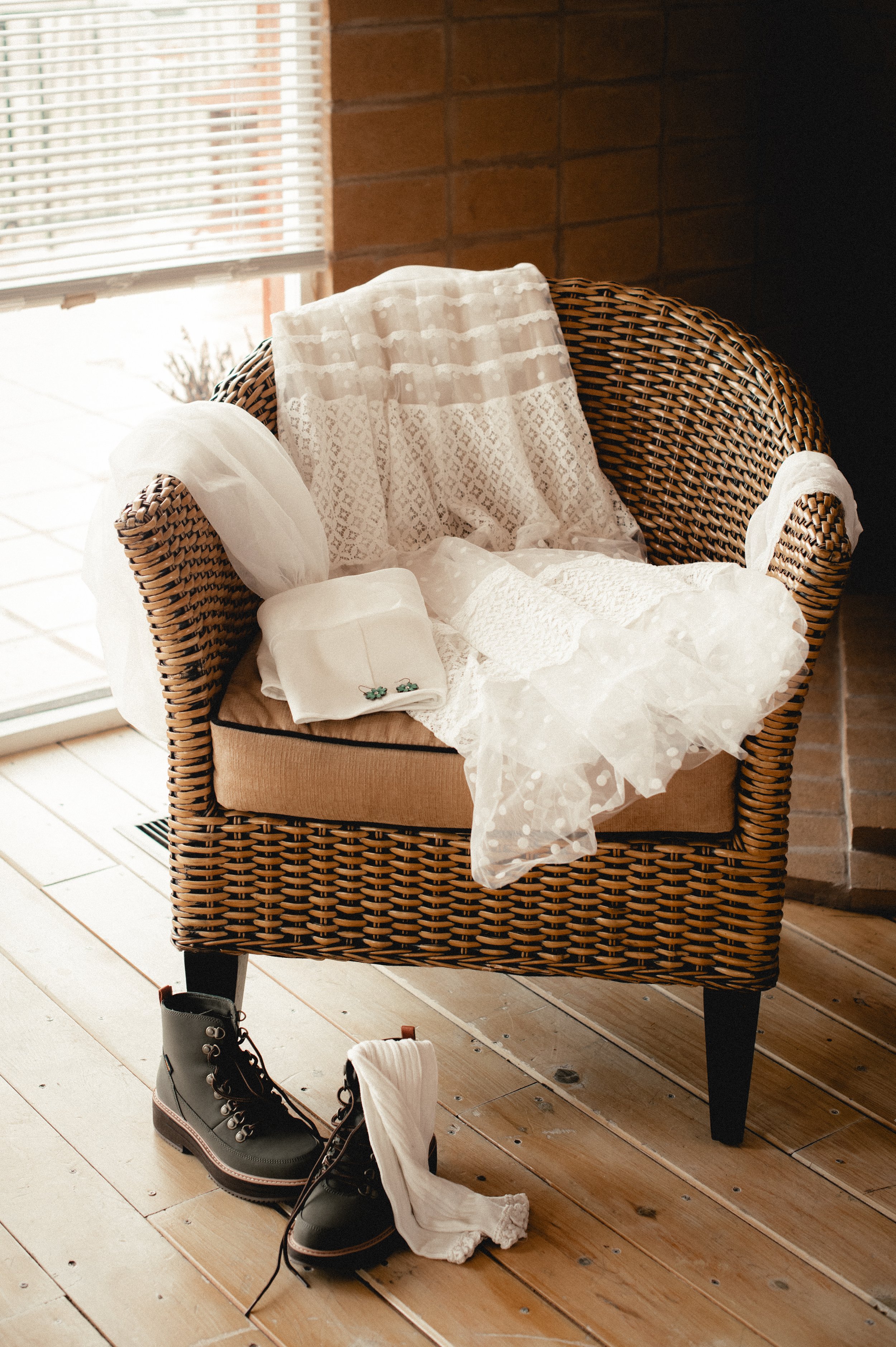 Brides Dress and hanging over a chair captured on Digital with film preset