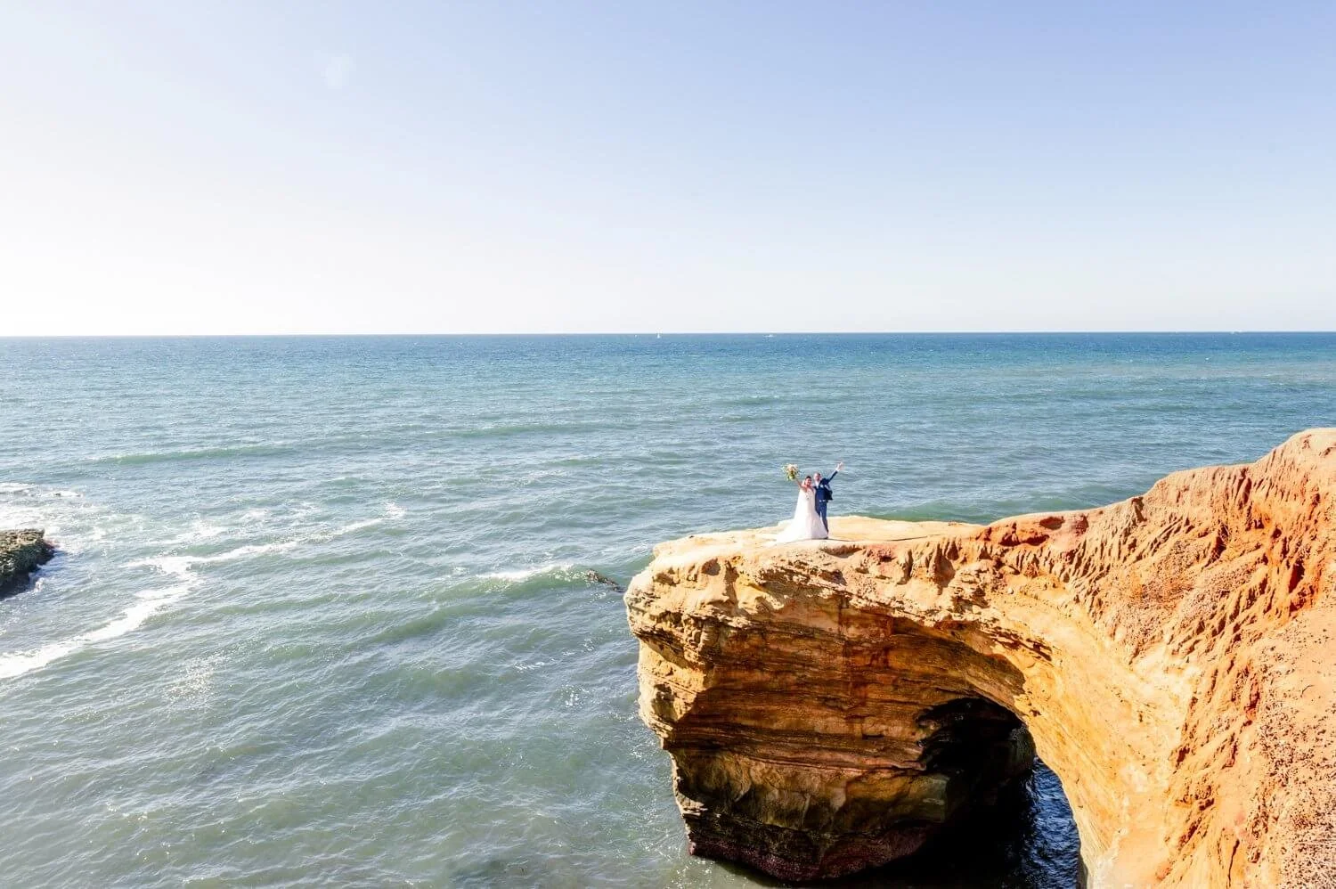 "Sunset Cliffs elopement photographer San Diego — couple at golden hour on the Pacific cliffs"