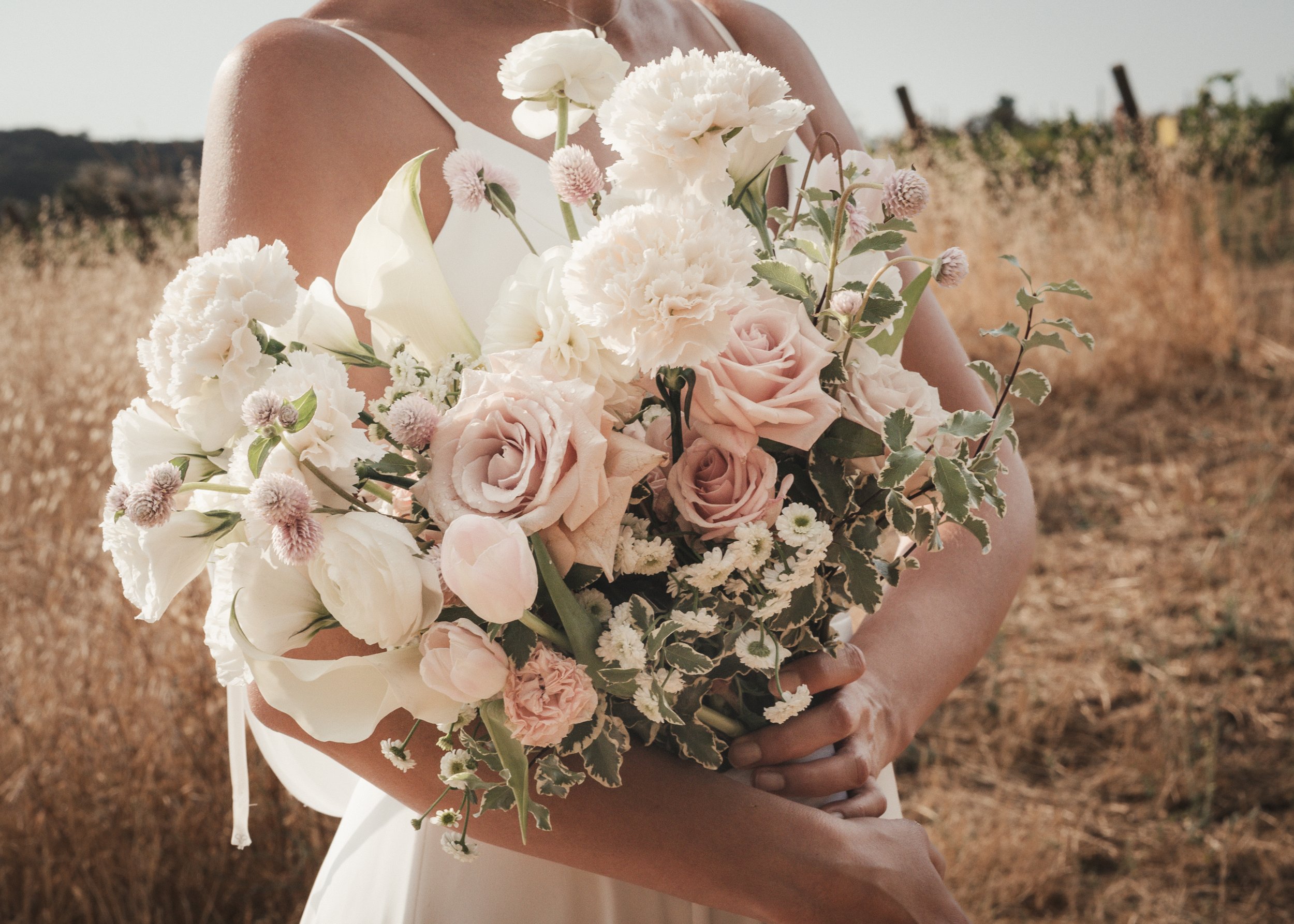 Bride holding her blush pink and white Bouquet