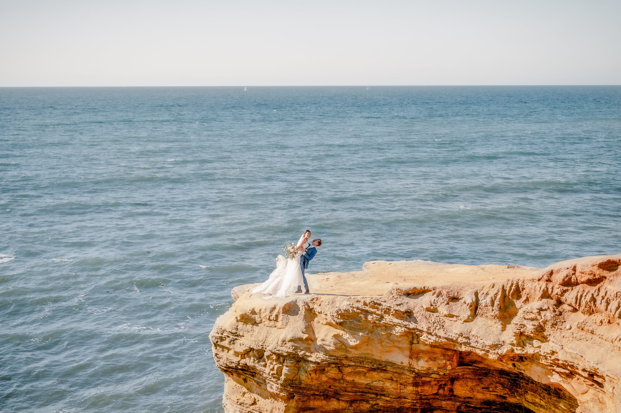 Sunset Cliffs elopement photographer San Diego — couple at afternoon light on the Pacific cliffs