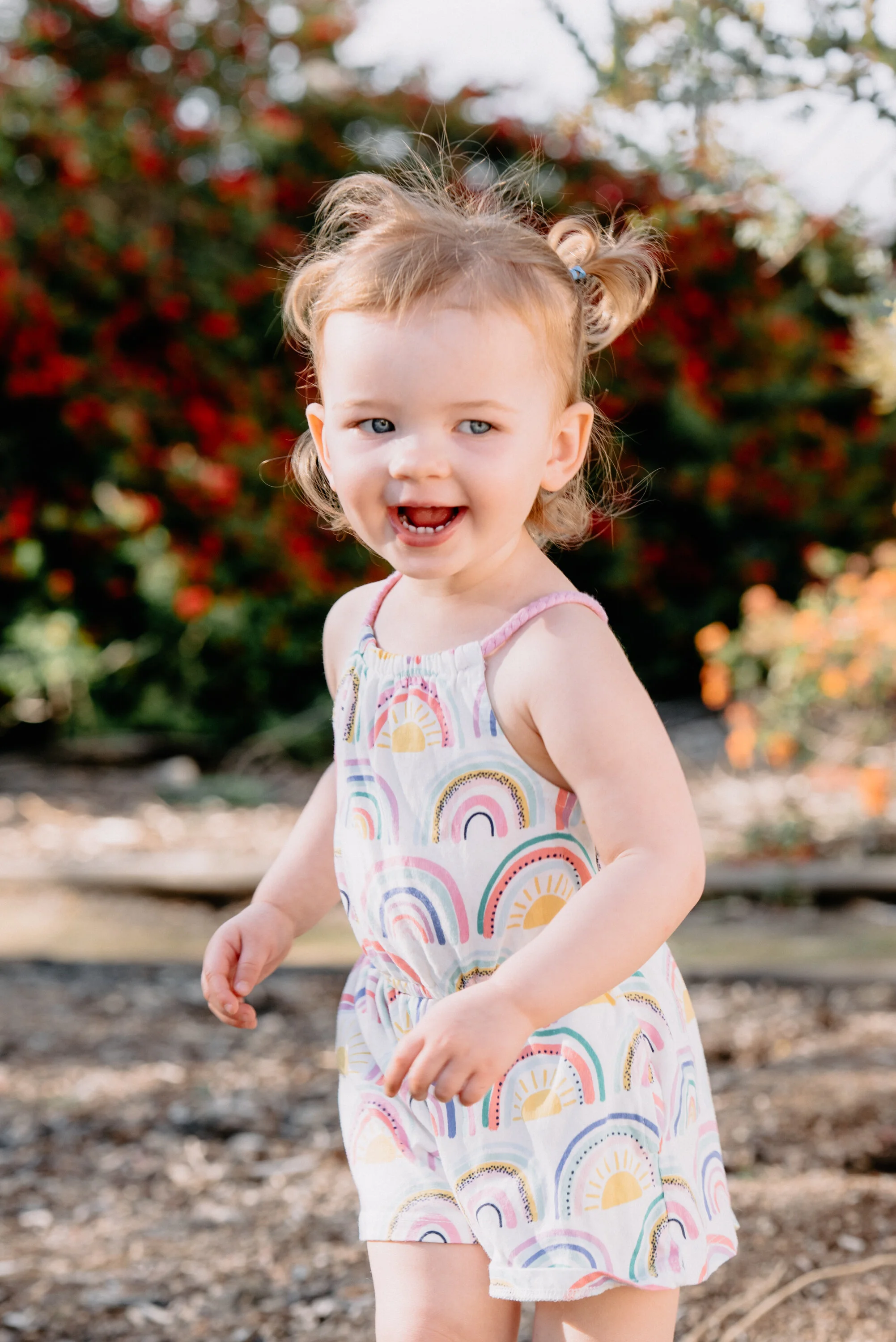 portrait candid of a toddler running and enjoying the outdoors