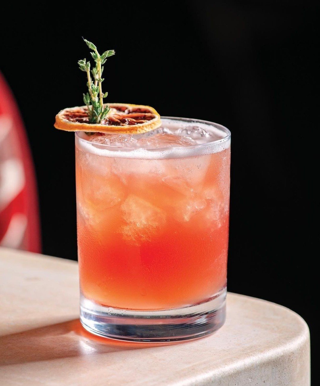 Meet Norman's 'Thyme Keeper' - as featured in @sblifeandstyle - this bourbon-amaro concoction is punched up with a housemade pomegranate reduction syrup, bruto americano, ginger beer, and topped with a sprig of thyme and a blood orange. Fresh, herbal