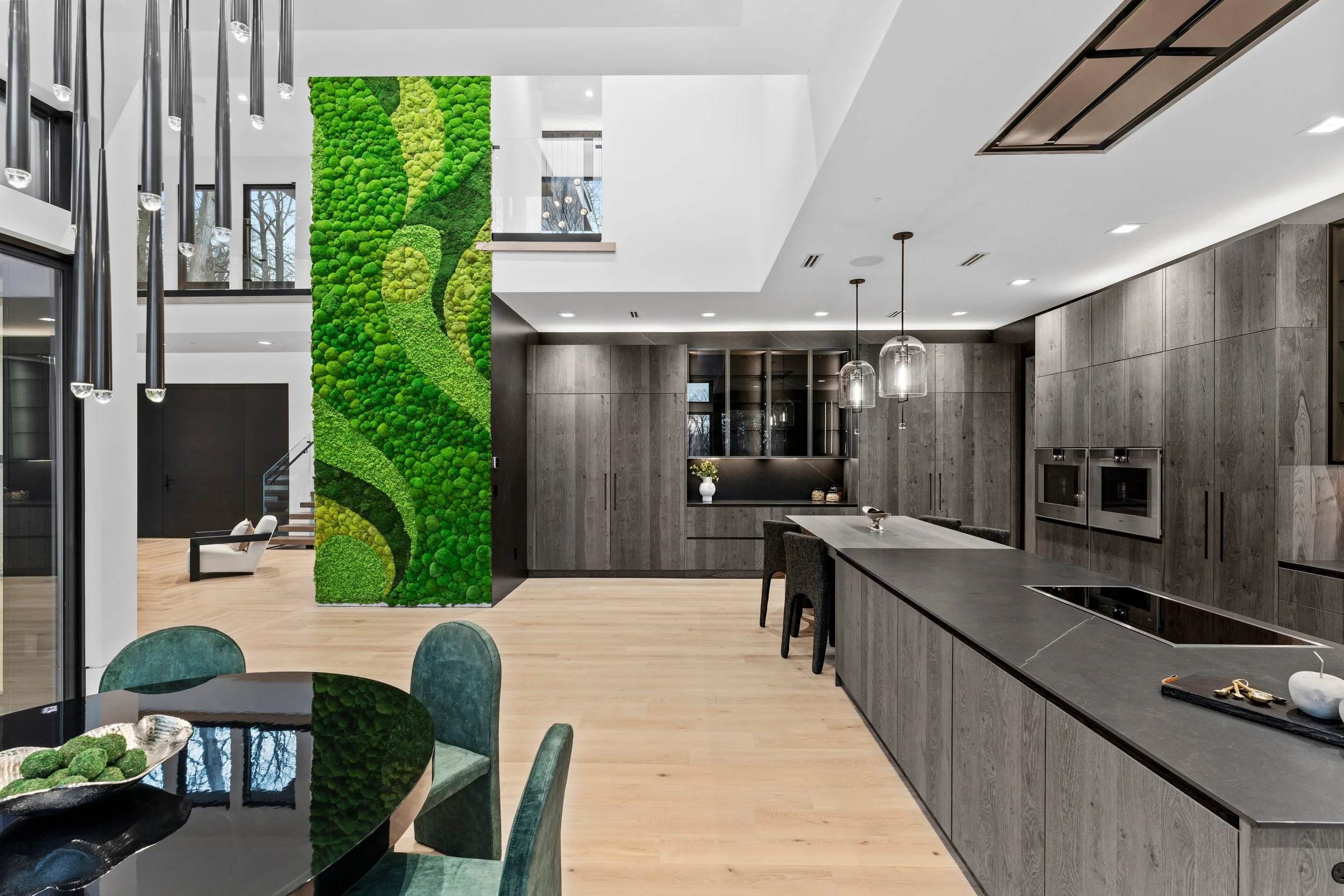Custom moss art on double-height structural column in luxury open-plan residence, Englewood NJ by Urbanstrong