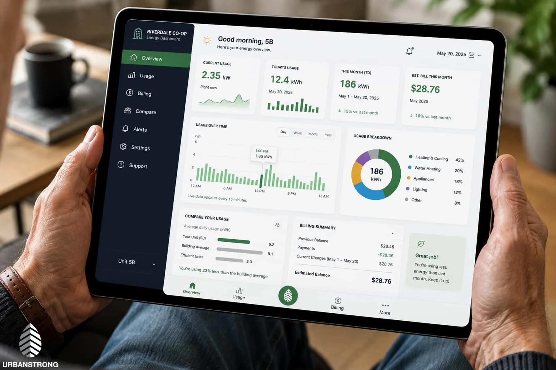 Close-up of a resident using an Intelligent Submetering app dashboard showing real-time electricity usage, billing history, and energy monitoring for an Urbanstrong multifamily building client.