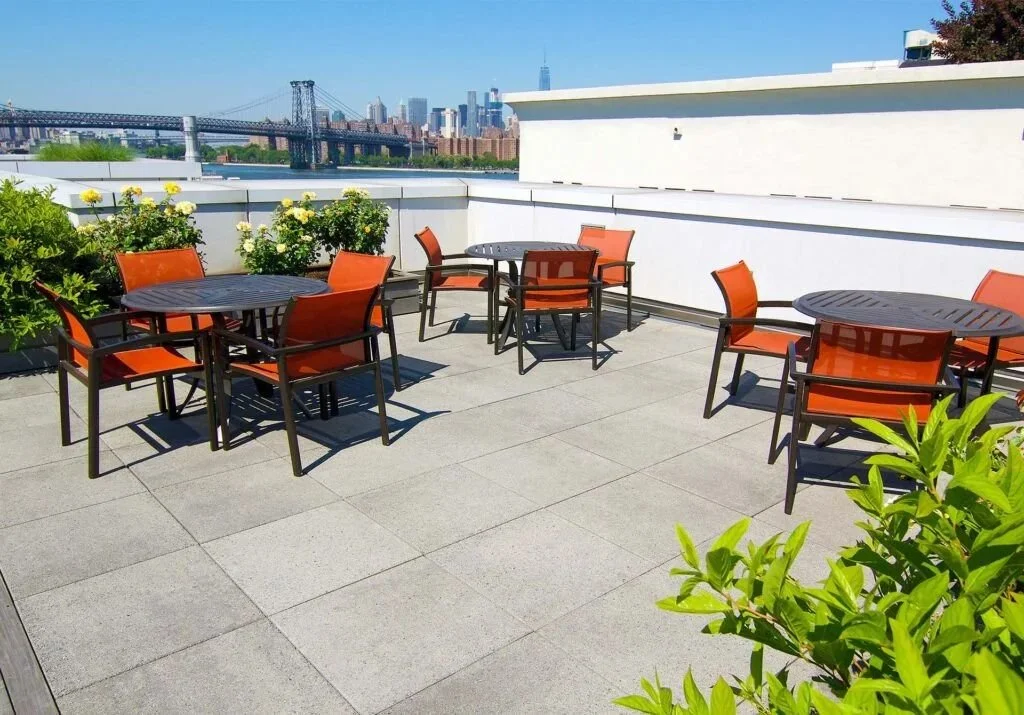 patio furniture on a NYC concrete paver deck using concealed wind uplift restraints