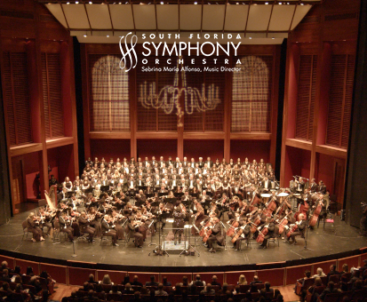 Full view of the South Florida Symphony Orchestra performing on stage in a concert hall.