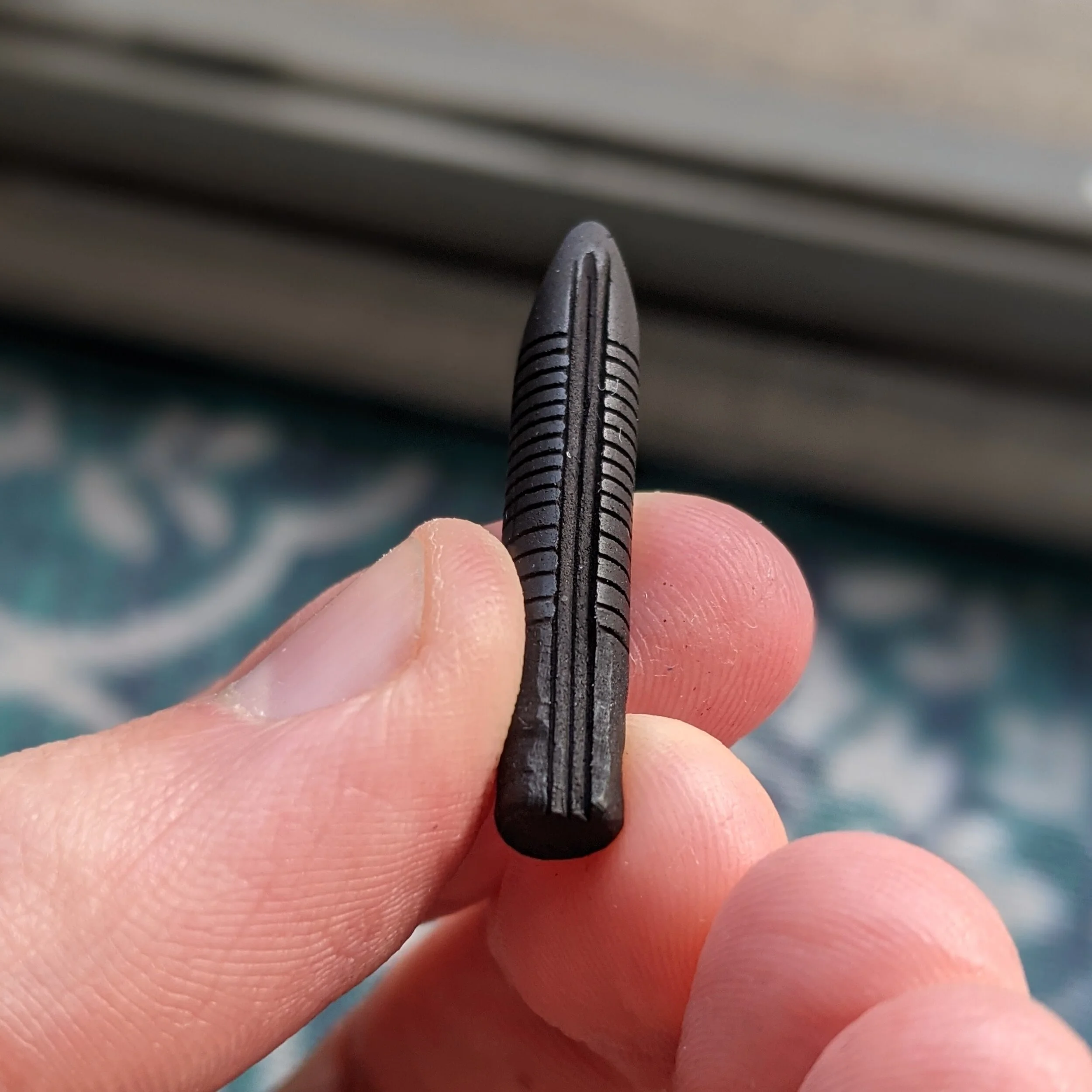 Here is an example of an ebonite feed from Fountain pen revolution. I suspect that Noodler’s also uses the same exact manufacturer