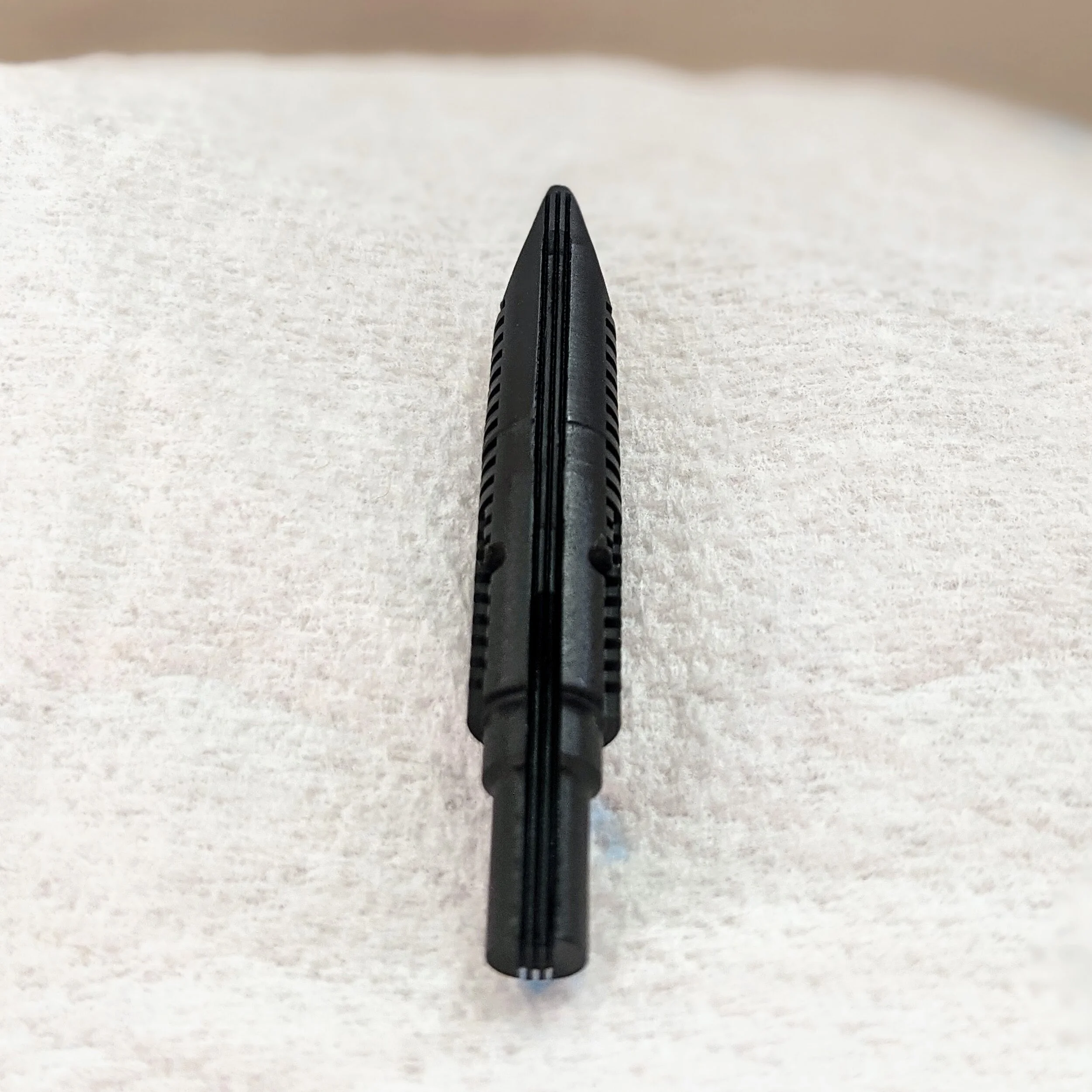 Here is an example of a feed made by Flexible Nib Factory for a Pilot CH 742 #10 FA nib. You can see this has 3 ink channels/slits compared to the regular Pilot feed.