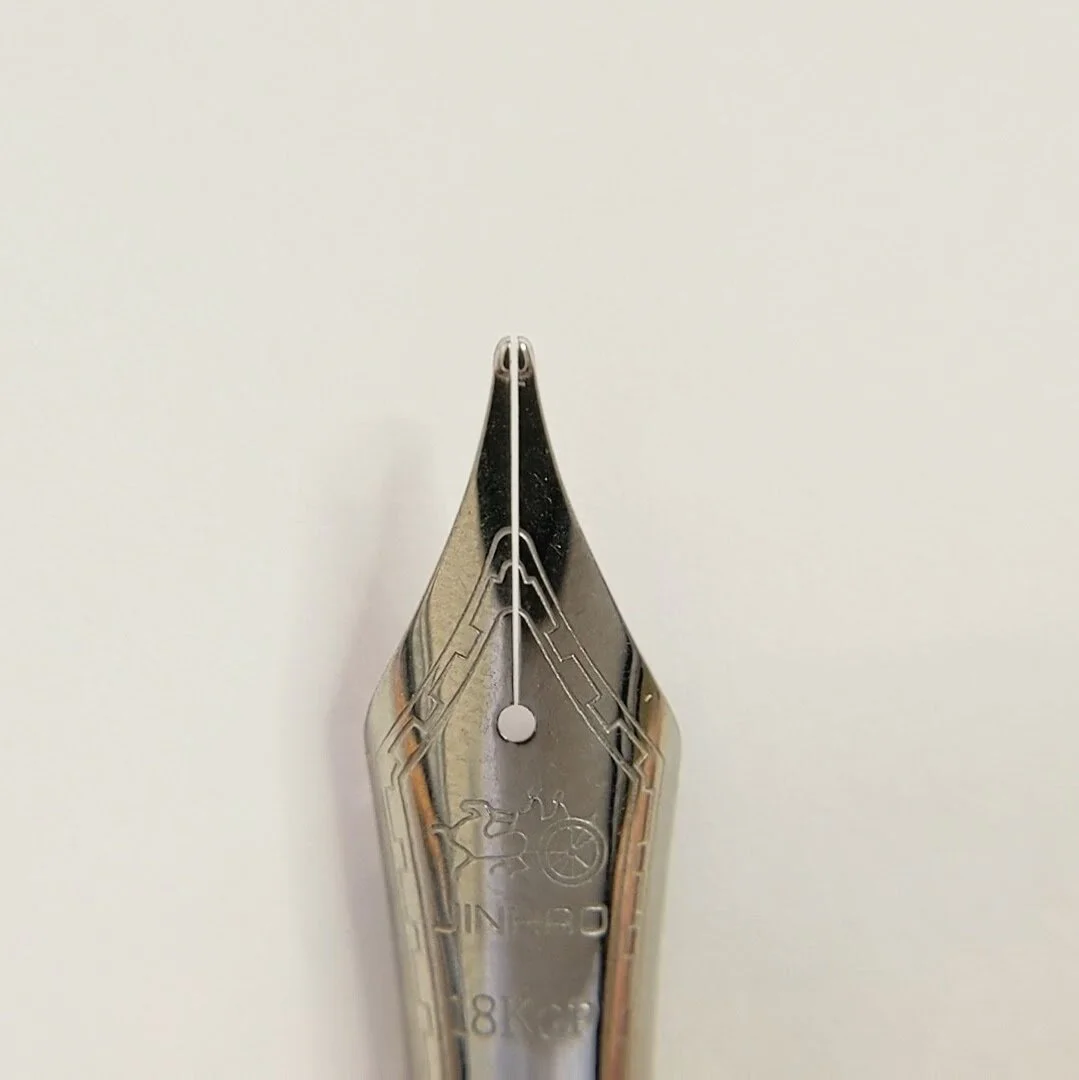 This is an example of a tine gap that is too large. You can see that the gap at the breather hole is smaller than the gap at the end of the tines. This will be prone to hard starts.