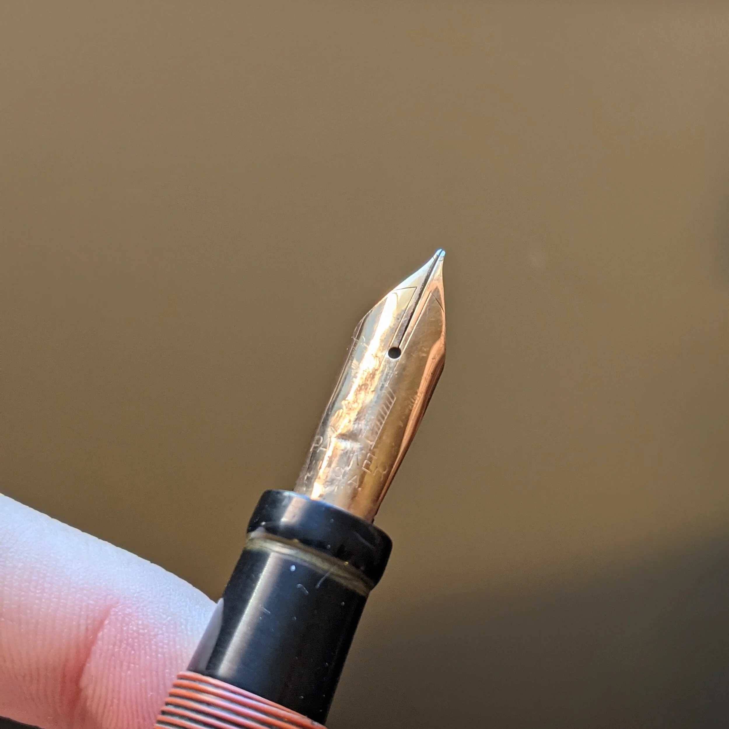 This is an example of a Parker nib that has some damage. Taking out that damage would be difficult as the damage caused strain hardening.