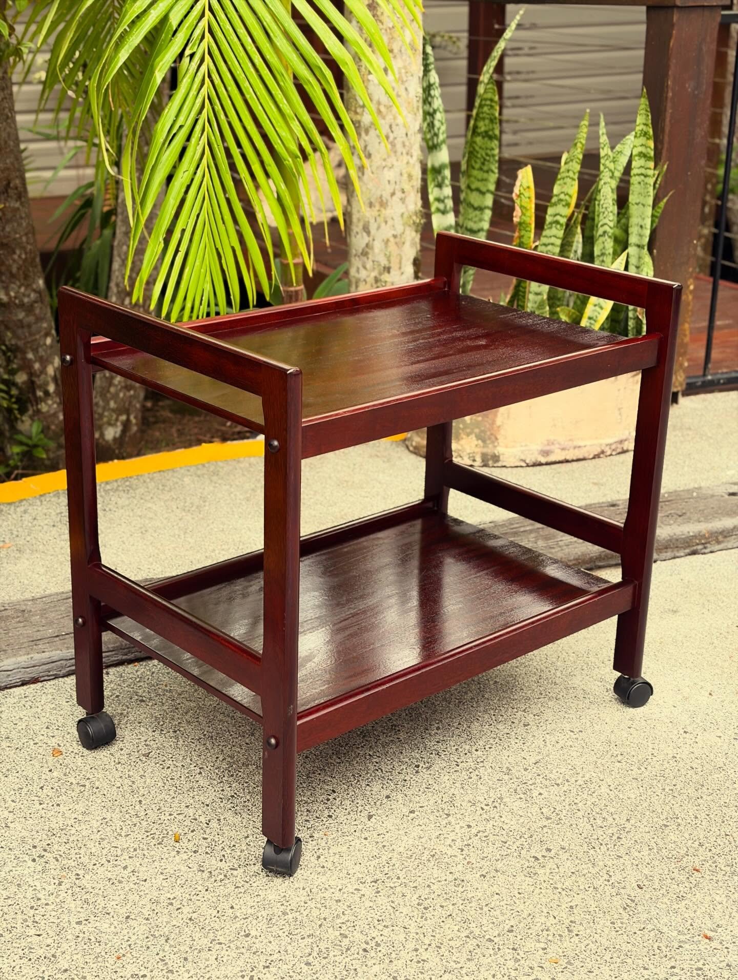 Mid Century Cocktail Cart

Perfect for the Mixologist in the house, great for storing all of your cocktail making gear
Smooth castors, portable and functional

1940&rsquo;s
Solid Mahogany 
Fully restored 

68cm long
43cm wide
64cm high

$240