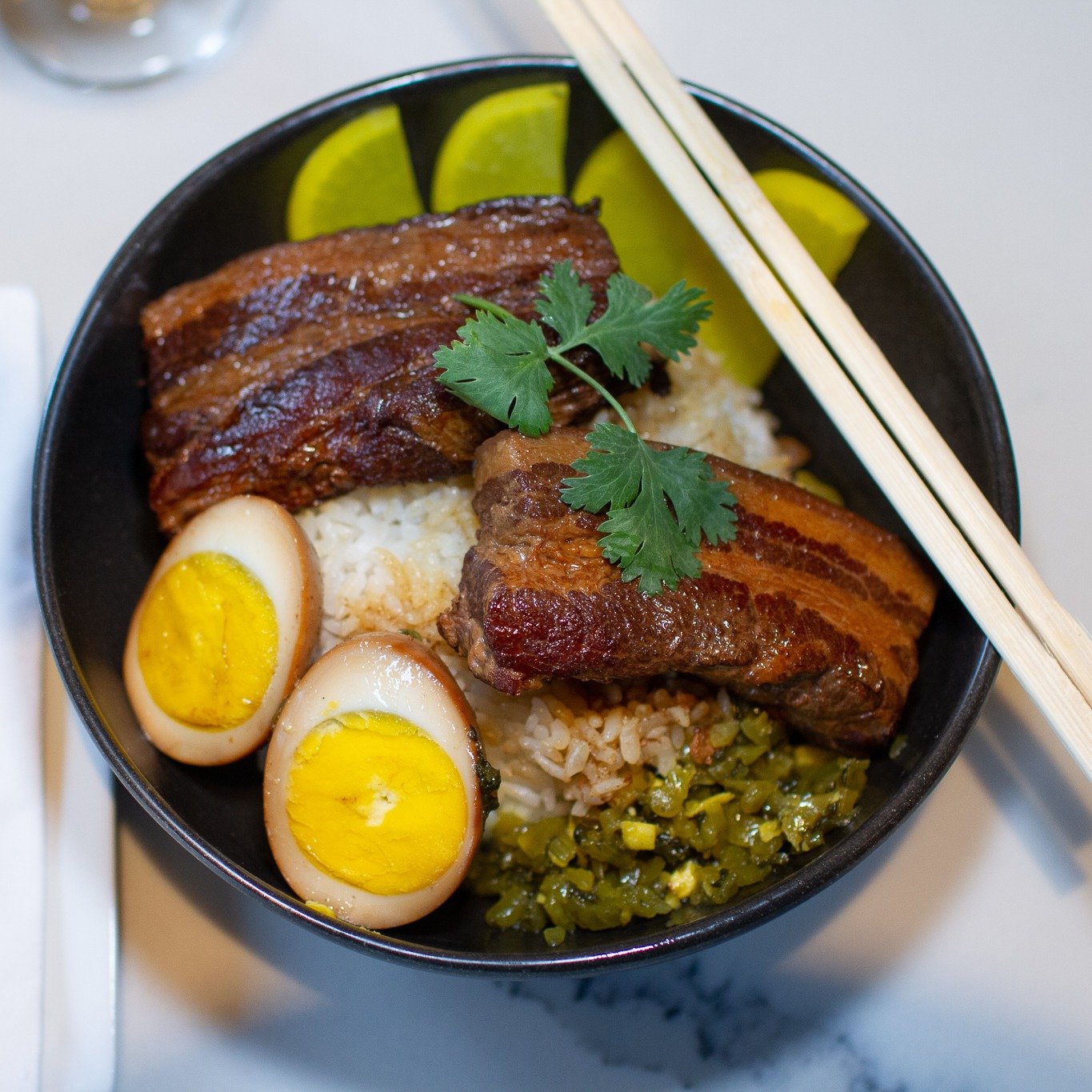 We love choices. You can change our regular braised pork belly rice bowl (滷肉飯 Lu Rou Fan) into Jumbo Pork Belly Rice Bowl (焢肉飯) with braised egg and pickled mustard green.

Both are some of the most beloved Taiwanese comfort foods. The pork belly wit