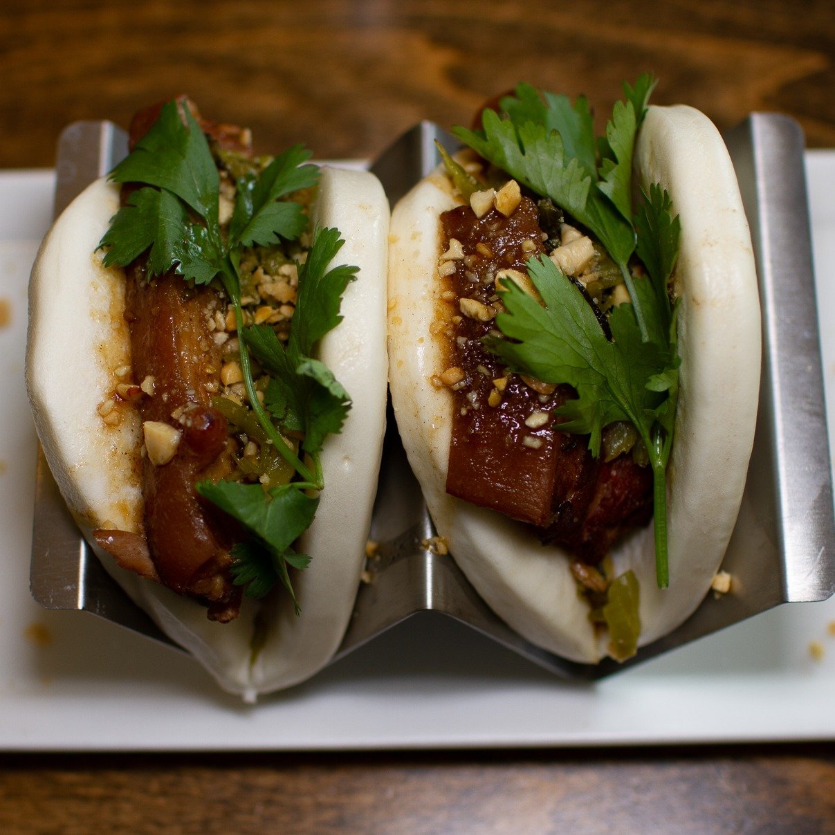 Taiwanese Pork Belly Bao, a.k.a Gua Bao (割包). It means a cut-open bun, originating from the coastal regions of Fujian province in China, Gua Bao is one of the most popular appetizers in Taiwan. We braised the skin-on pork belly with spices and soy sa