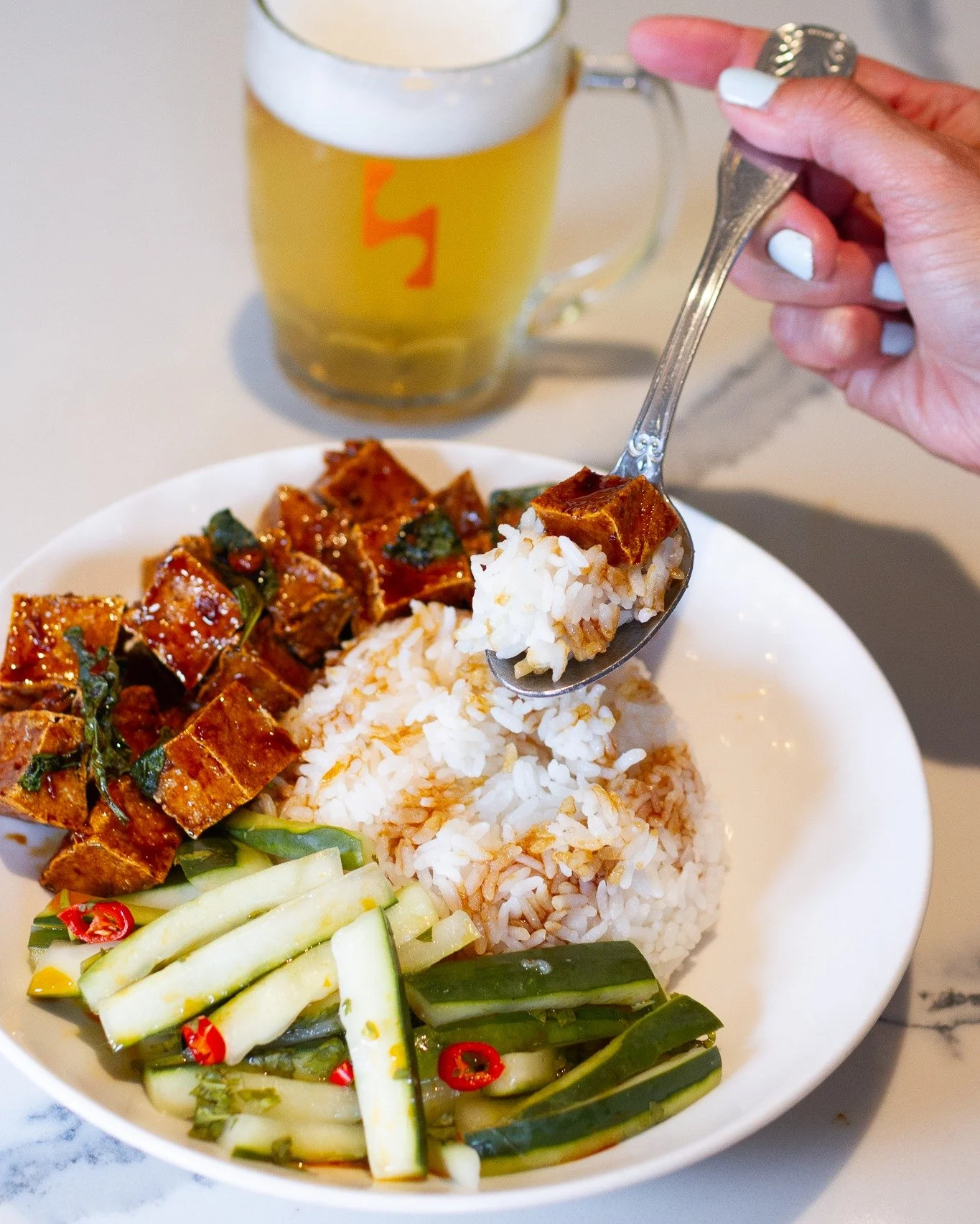 Our Three-Cup Tofu Rice Bowl is a Taiwanese classic with a High Side twist.
Crispy tofu simmered in soy sauce, rice wine, and sesame oil, tossed with basil, garlic, and chili, then served over rice. Aromatic, comforting, and Vegan Approved.

🍻 Happy