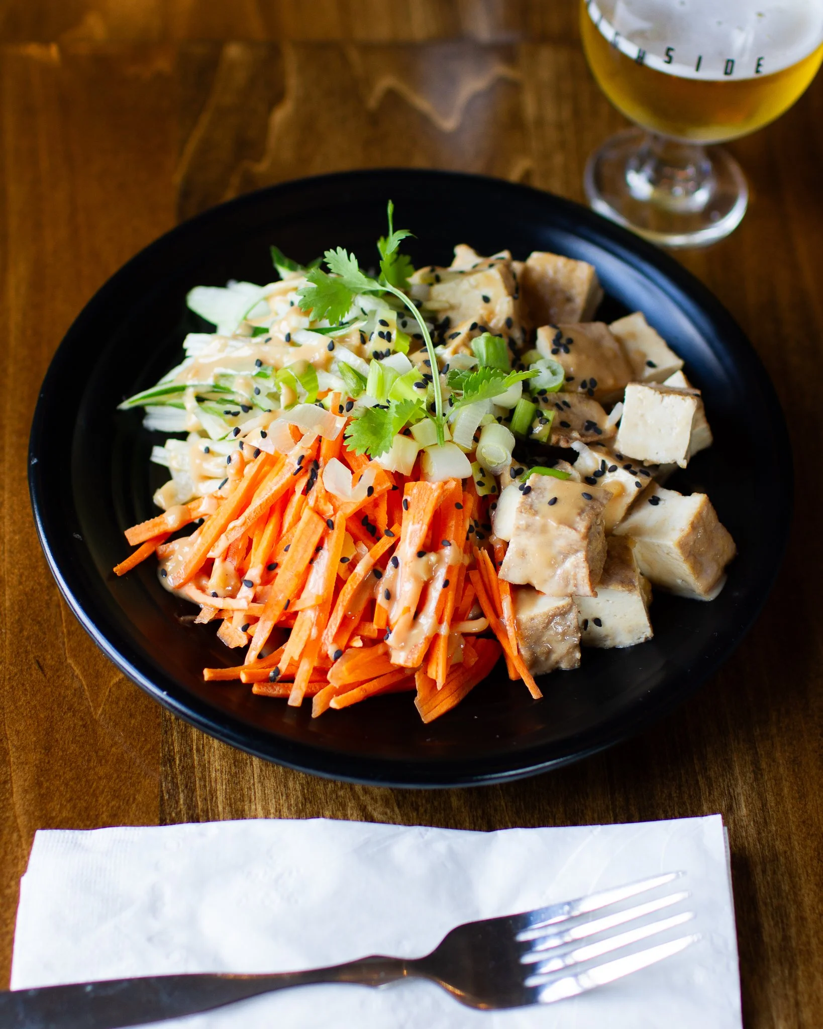 Cold Sesame Noodles are back on the menu: refreshing, light, and full of flavor. Made with wheat noodles, tofu, cucumbers, carrots, garlic, scallions, and our creamy sesame peanut sauce. 100% Vegan Approved and perfect for a healthy start to your wee
