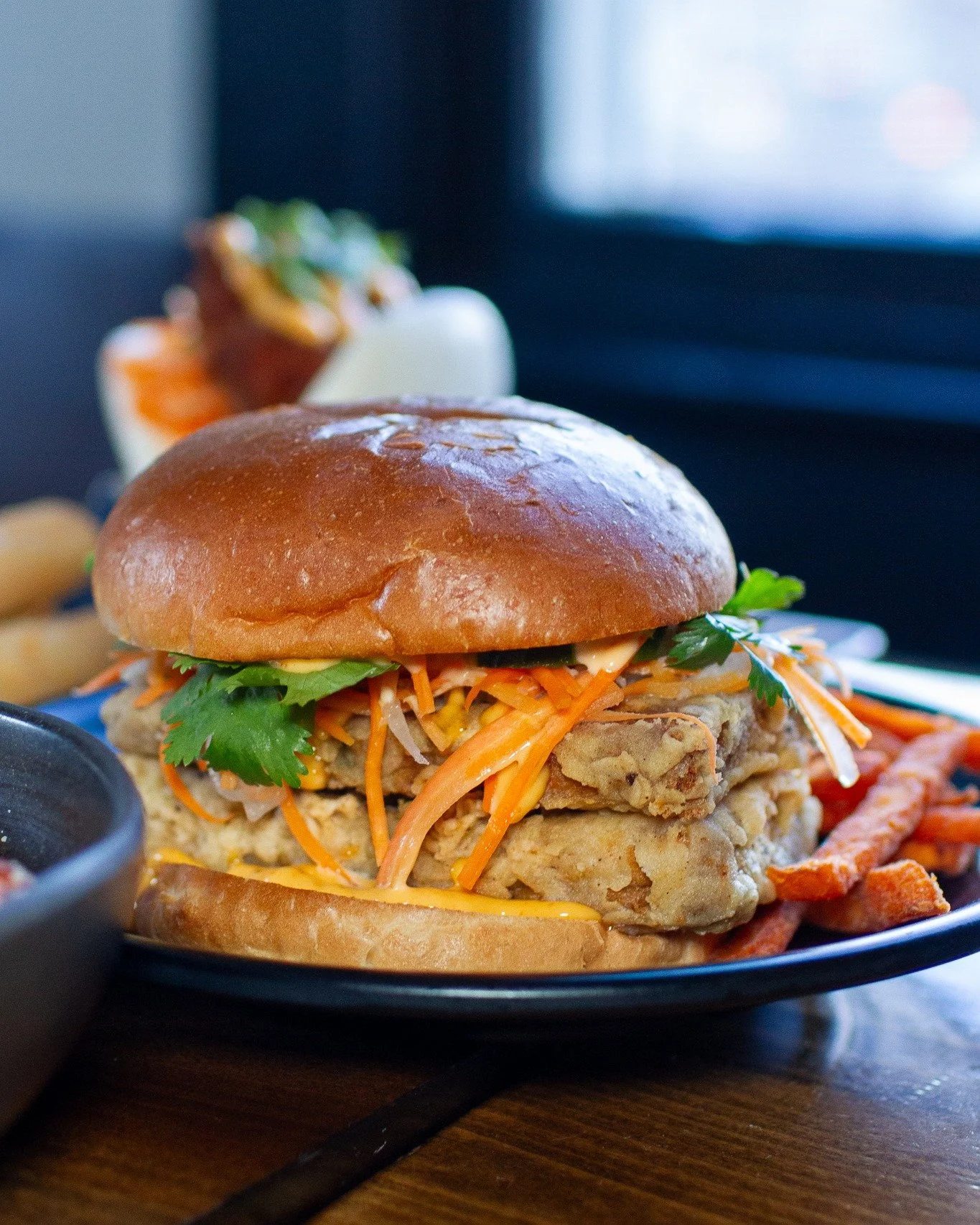 Tuesday and Wednesday just became your excuse to get a sandwich.

Every Tuesday &amp; Wednesday, our Fried Chicken Sandwich and Crispy Tofu Sandwich are 50% OFF all day, dine-in only.

Fried Chicken Sandwich: lemongrass-marinated fried chicken, Srira
